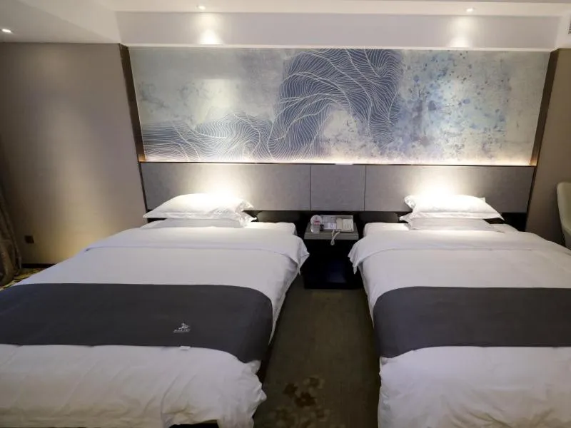 Bed in GreenTree Eastern Jingde Town Railway Station Hotel