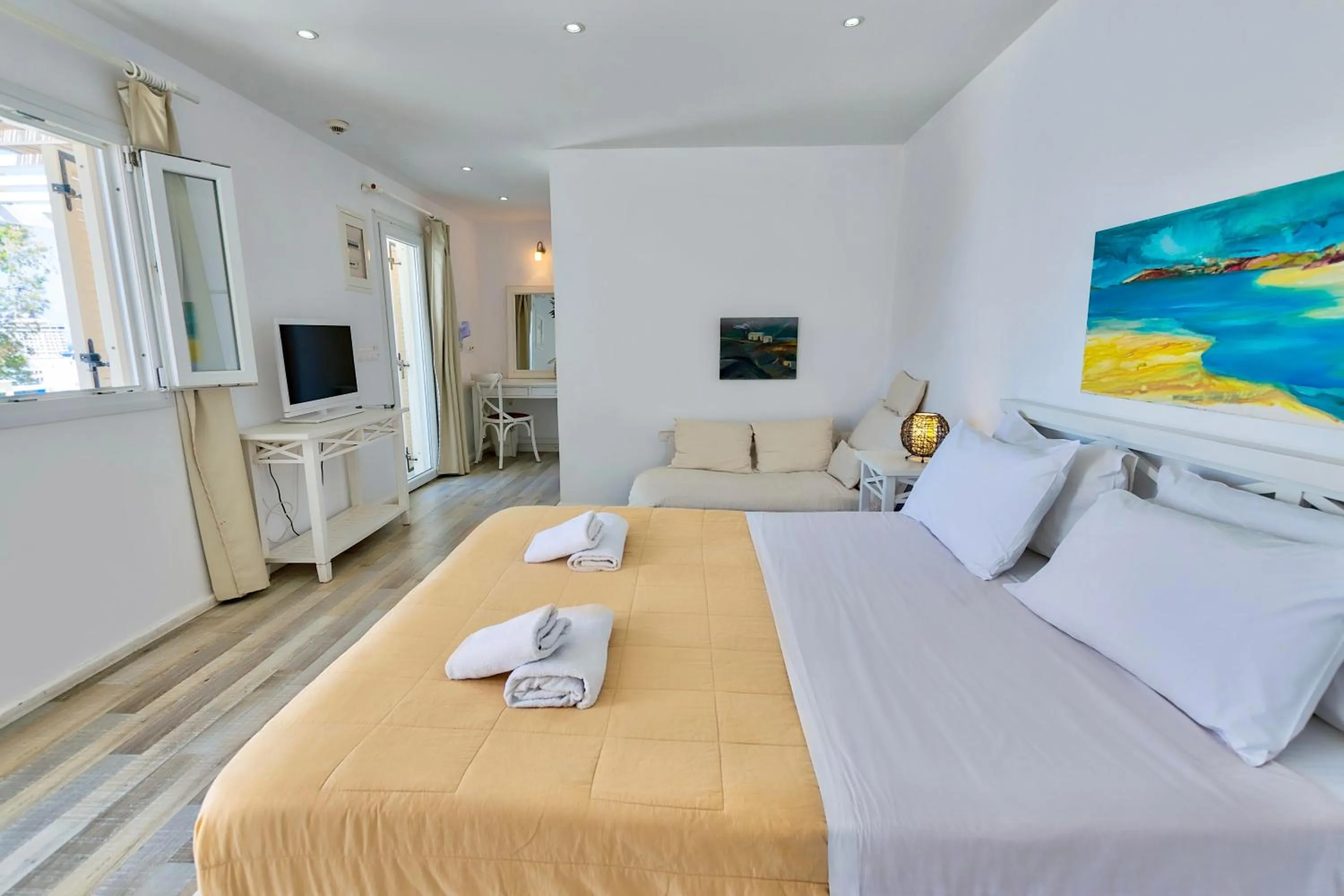 Bed in With-inn Mykonos Suites