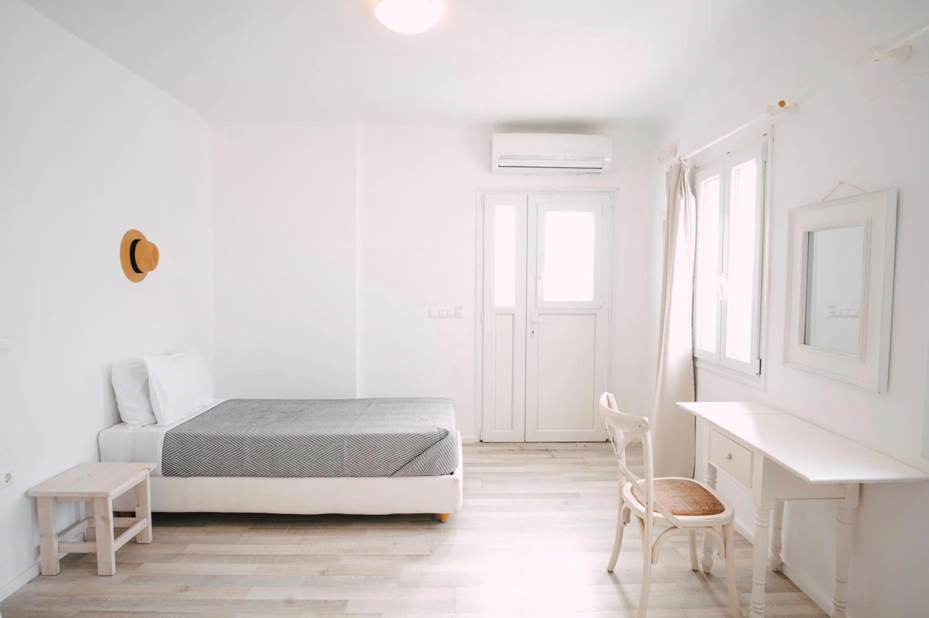 Bed in With-inn Mykonos Suites