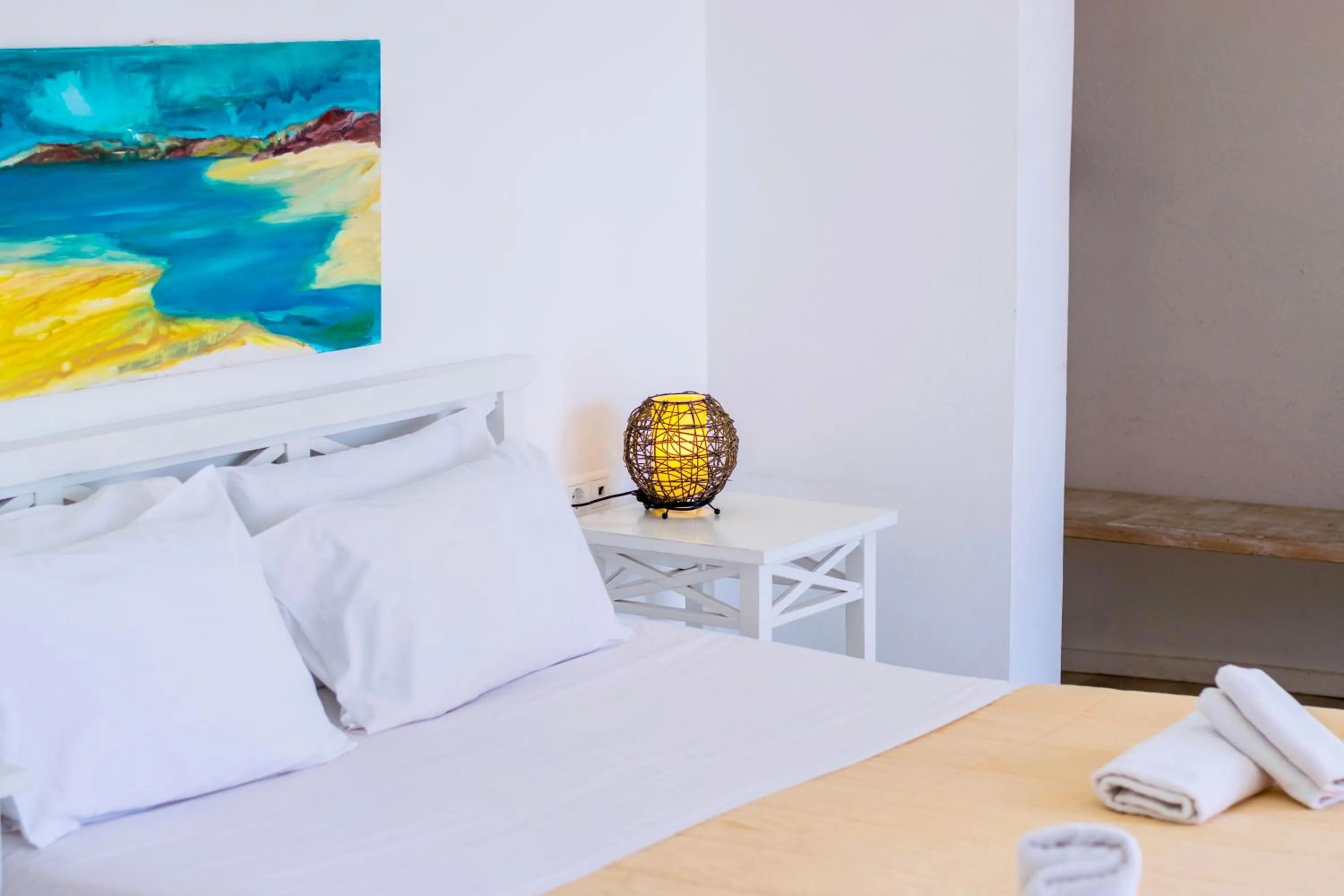 Bed in With-inn Mykonos Suites