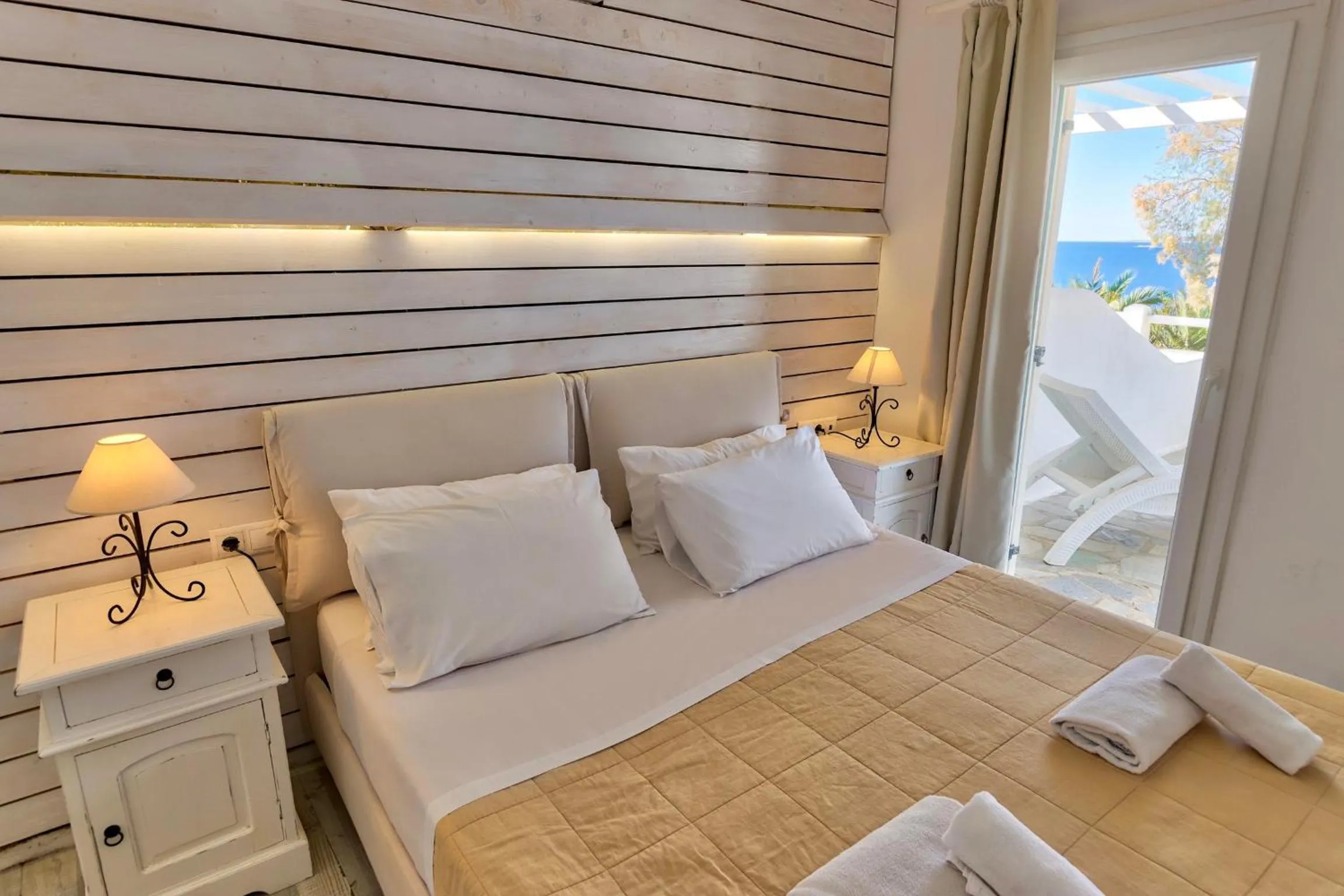 Bed in With-inn Mykonos Suites
