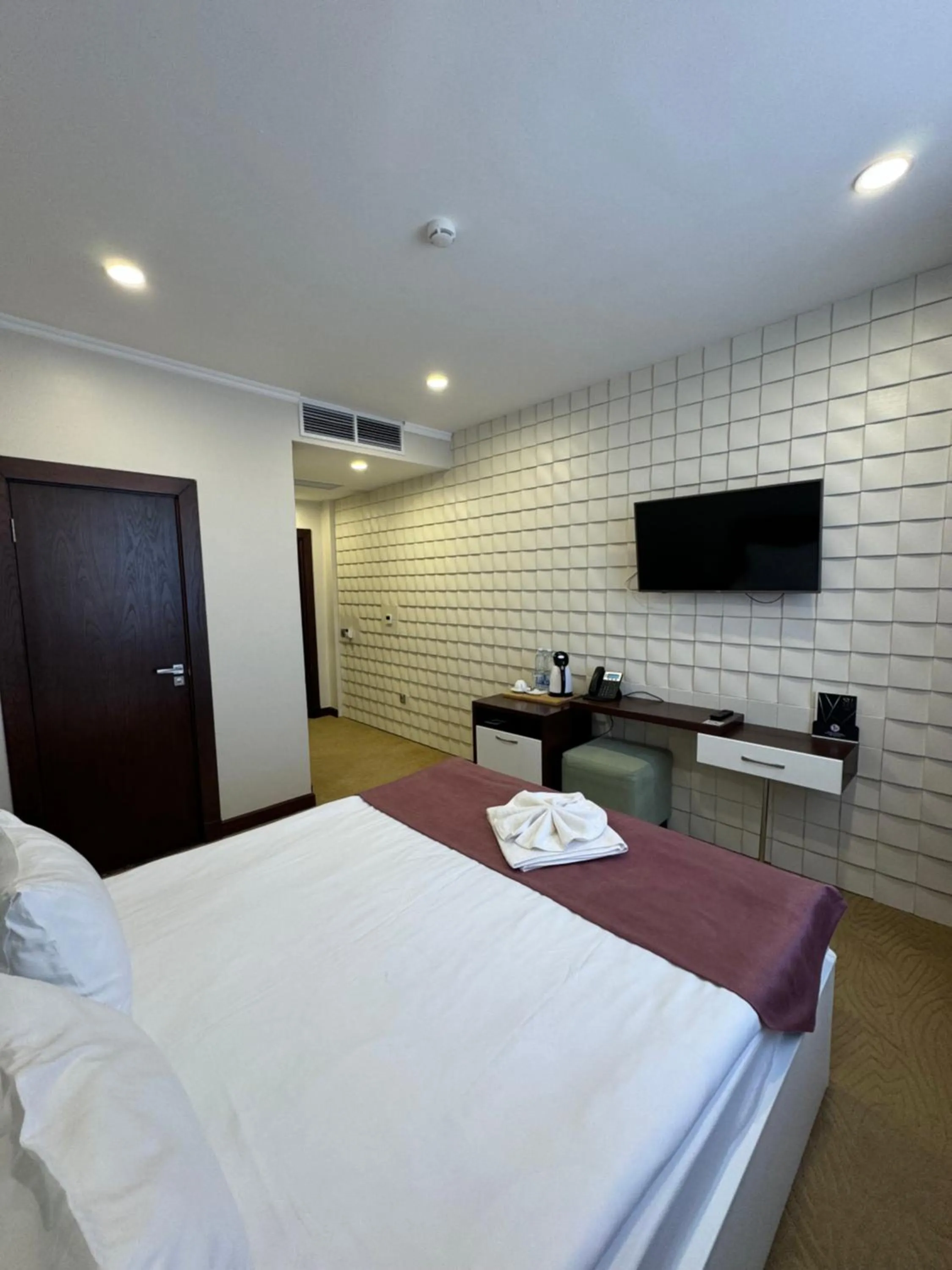 Bed in SULO Atyrau Hotel