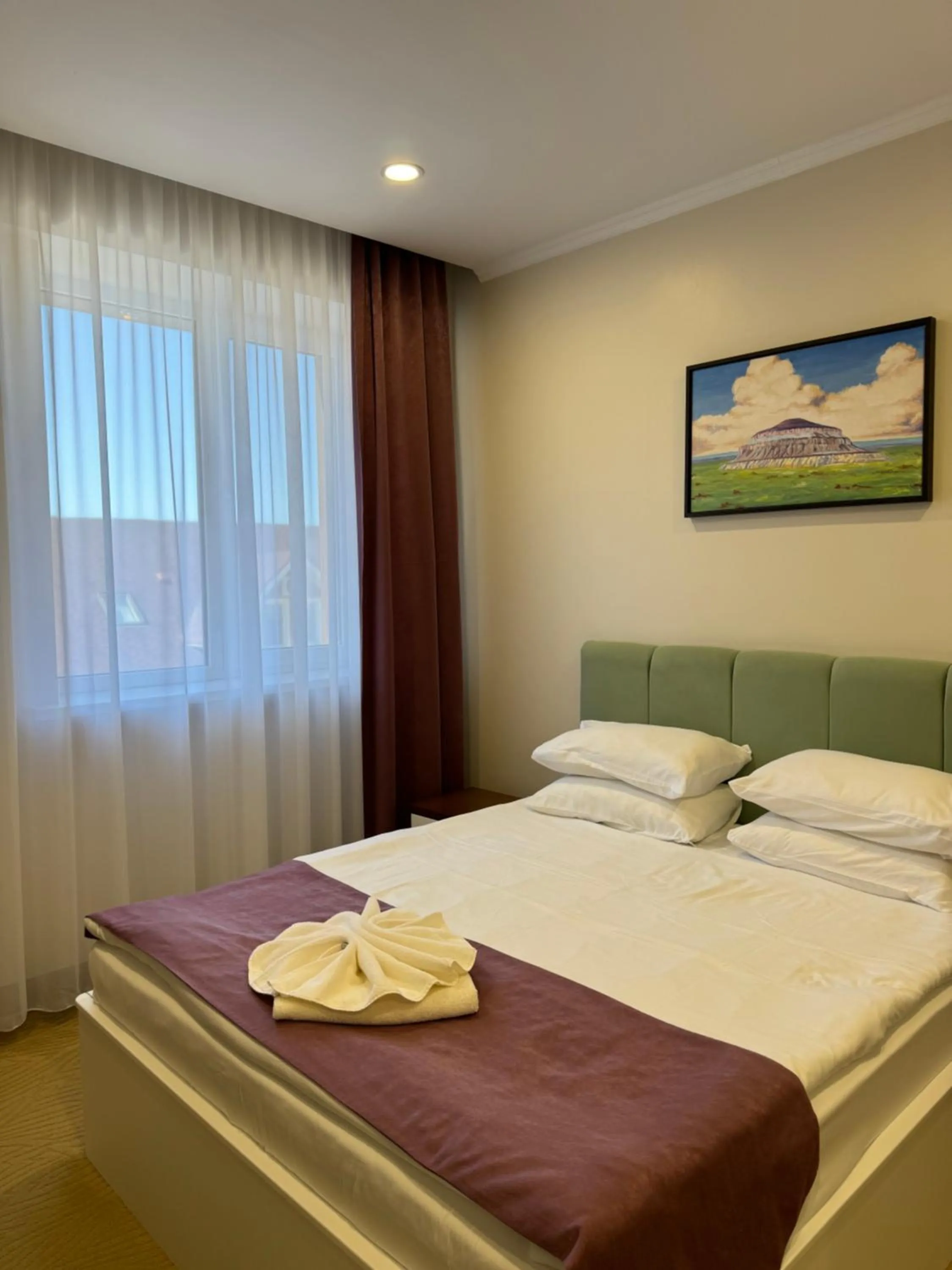 Bed in SULO Atyrau Hotel