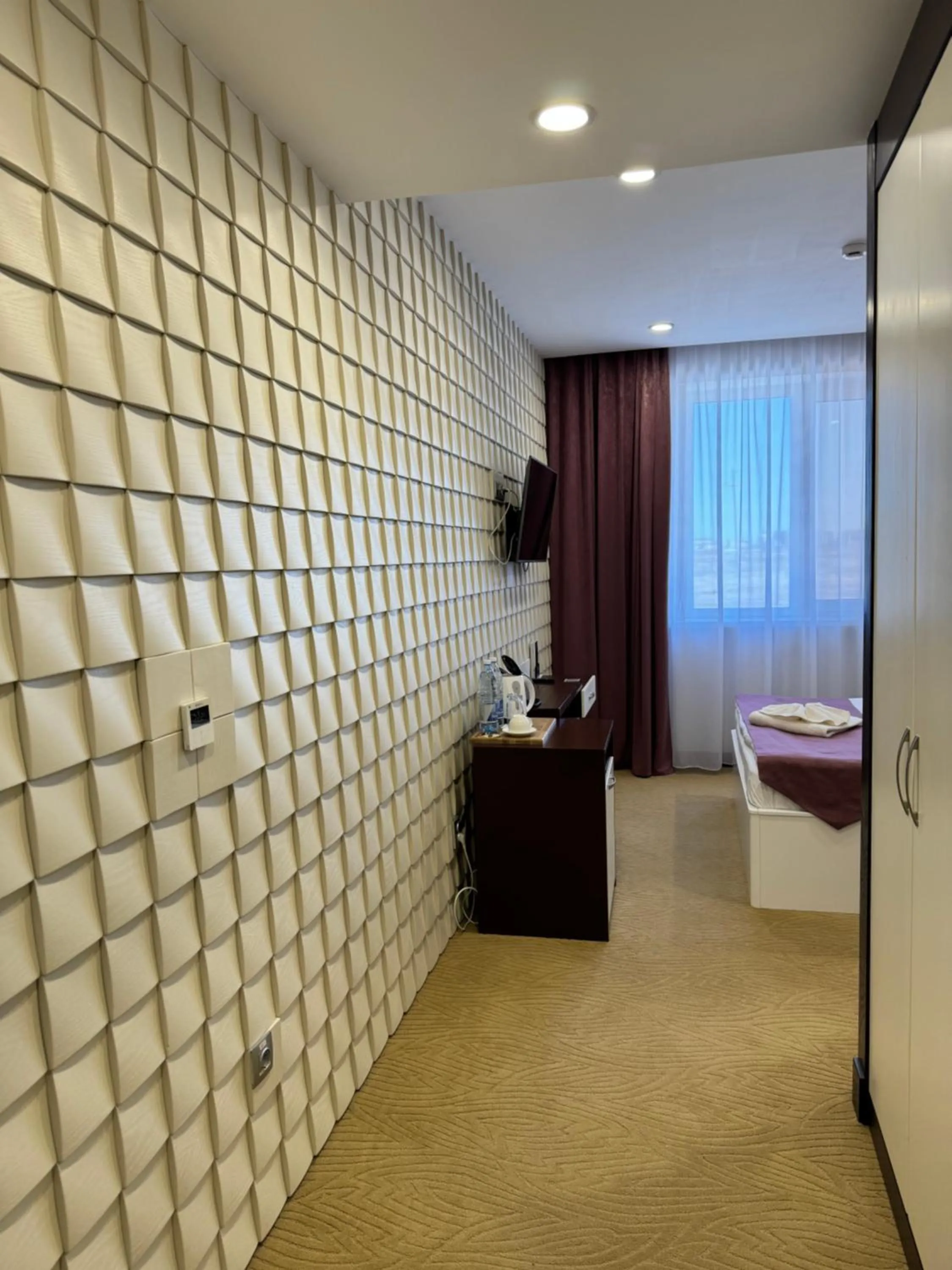 Bed in SULO Atyrau Hotel