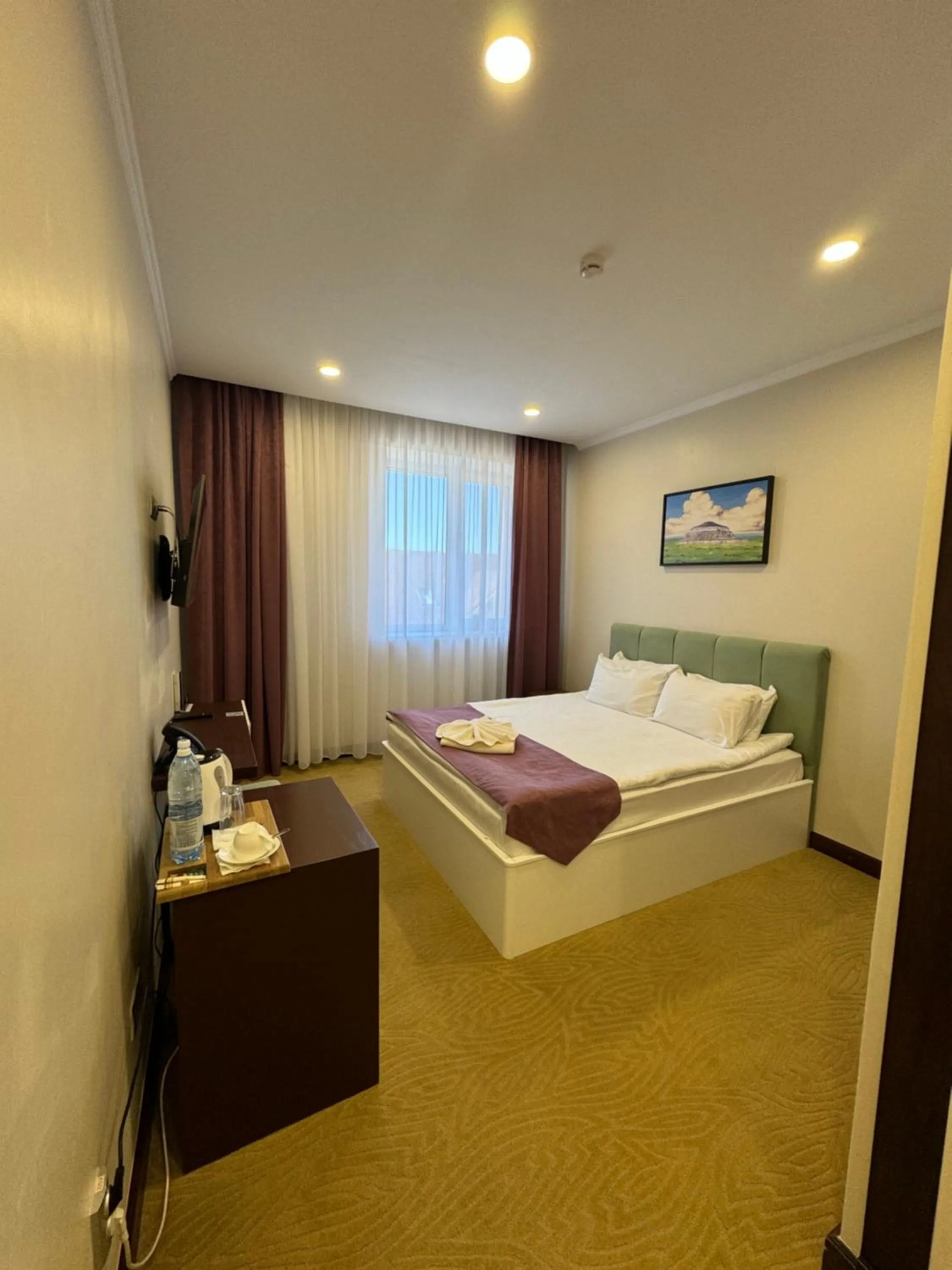 Bed in SULO Atyrau Hotel
