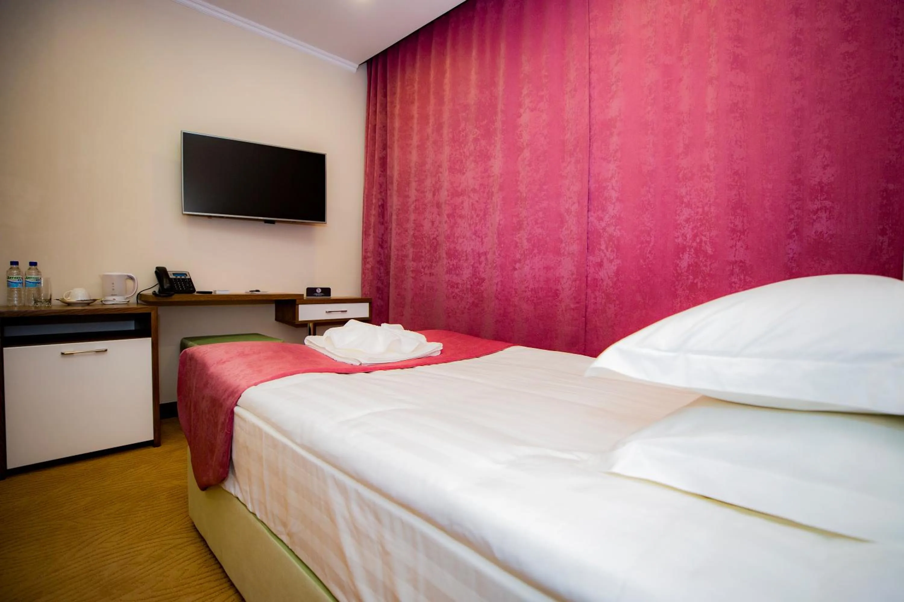 Bed in SULO Atyrau Hotel
