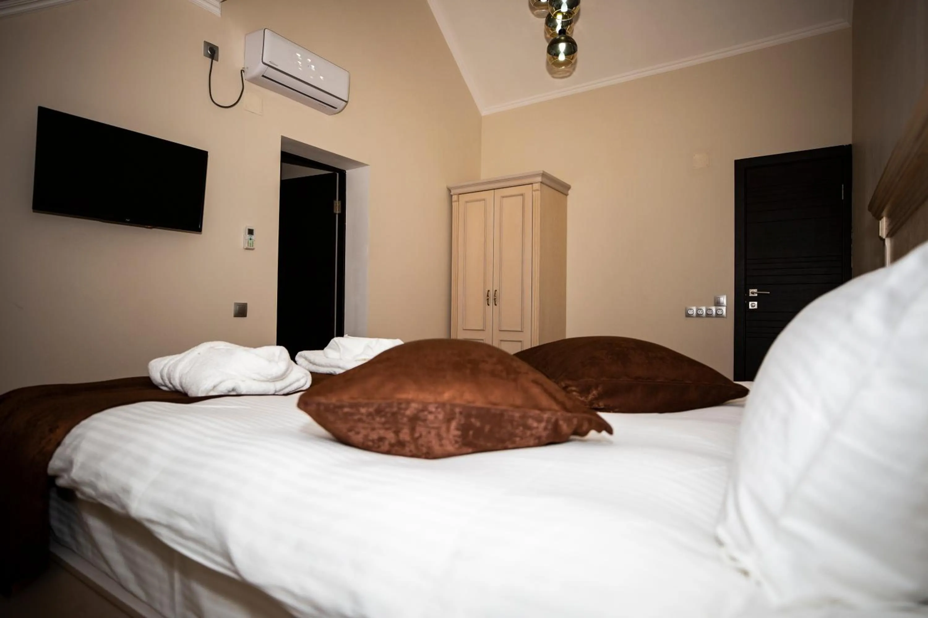 Bed in SULO Atyrau Hotel