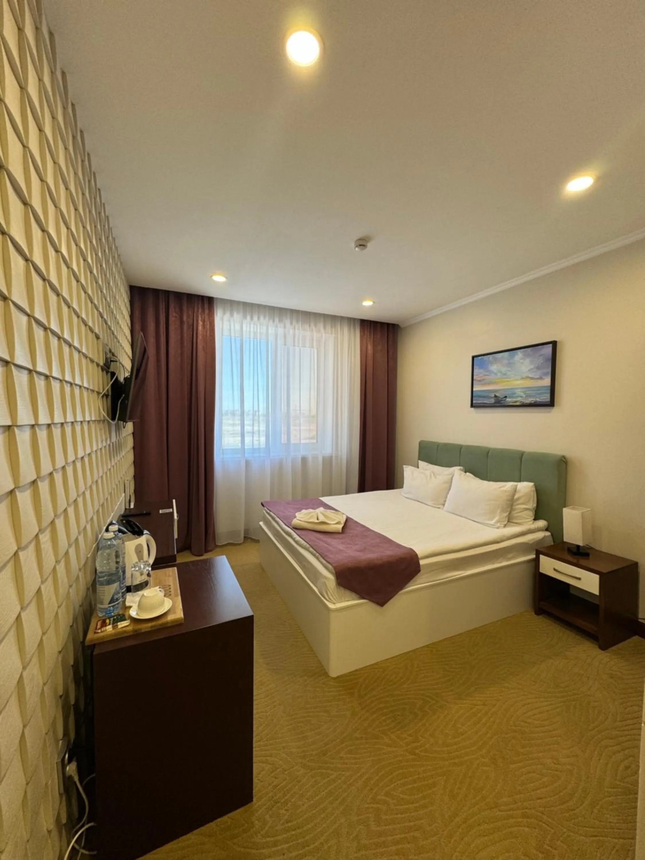 Bed in SULO Atyrau Hotel