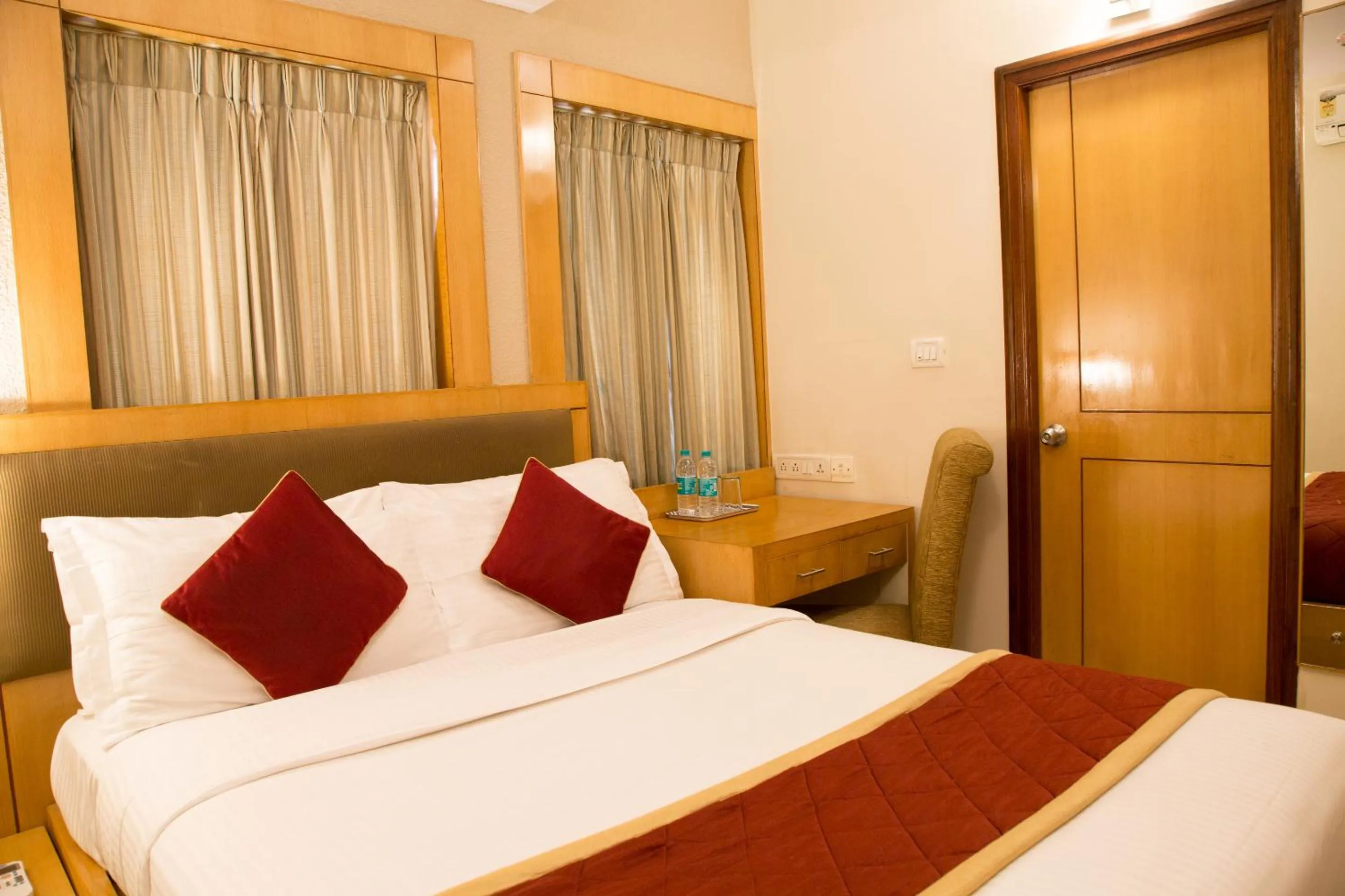 Bed in New Rainbow Business Hotel