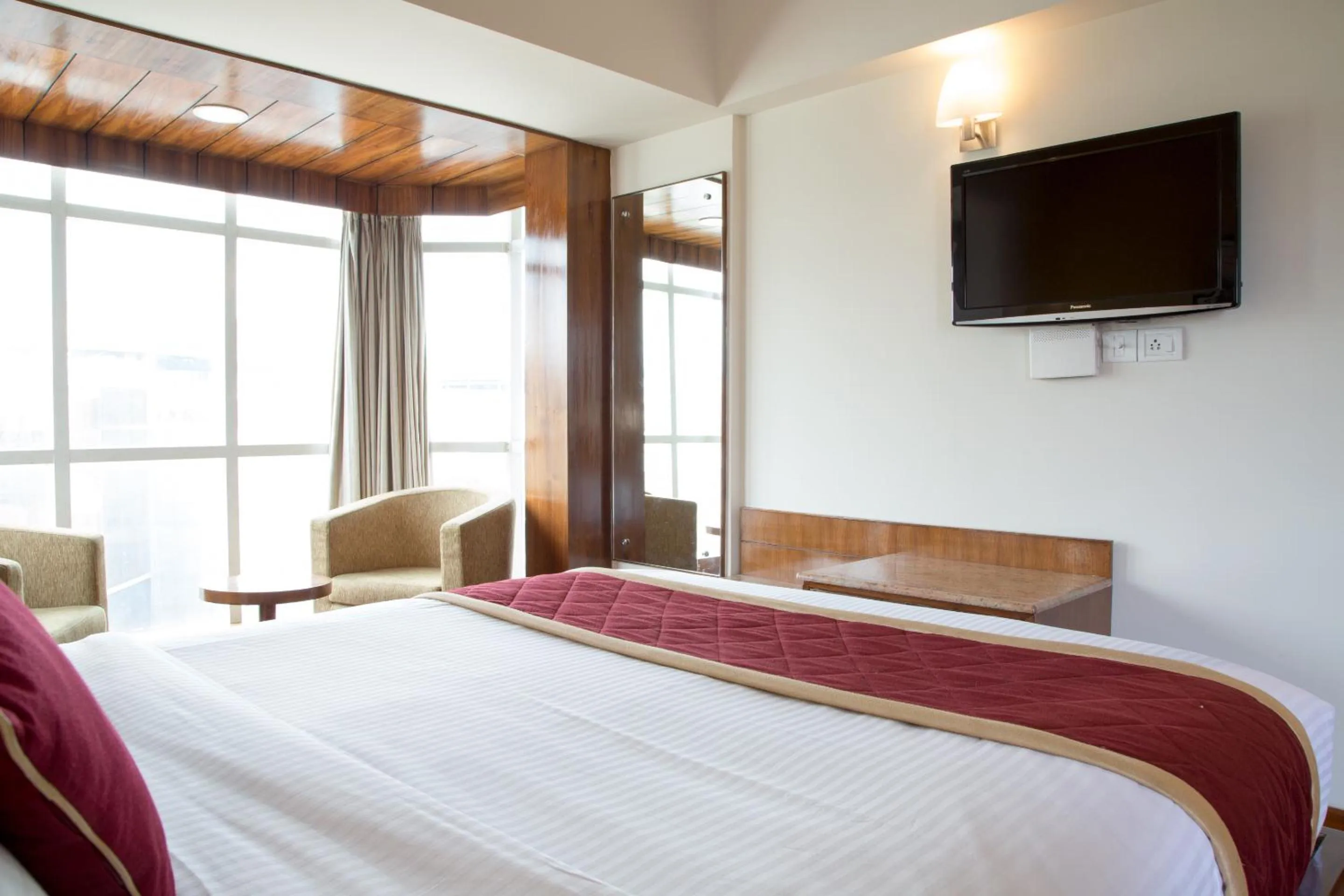 Bed in New Rainbow Business Hotel