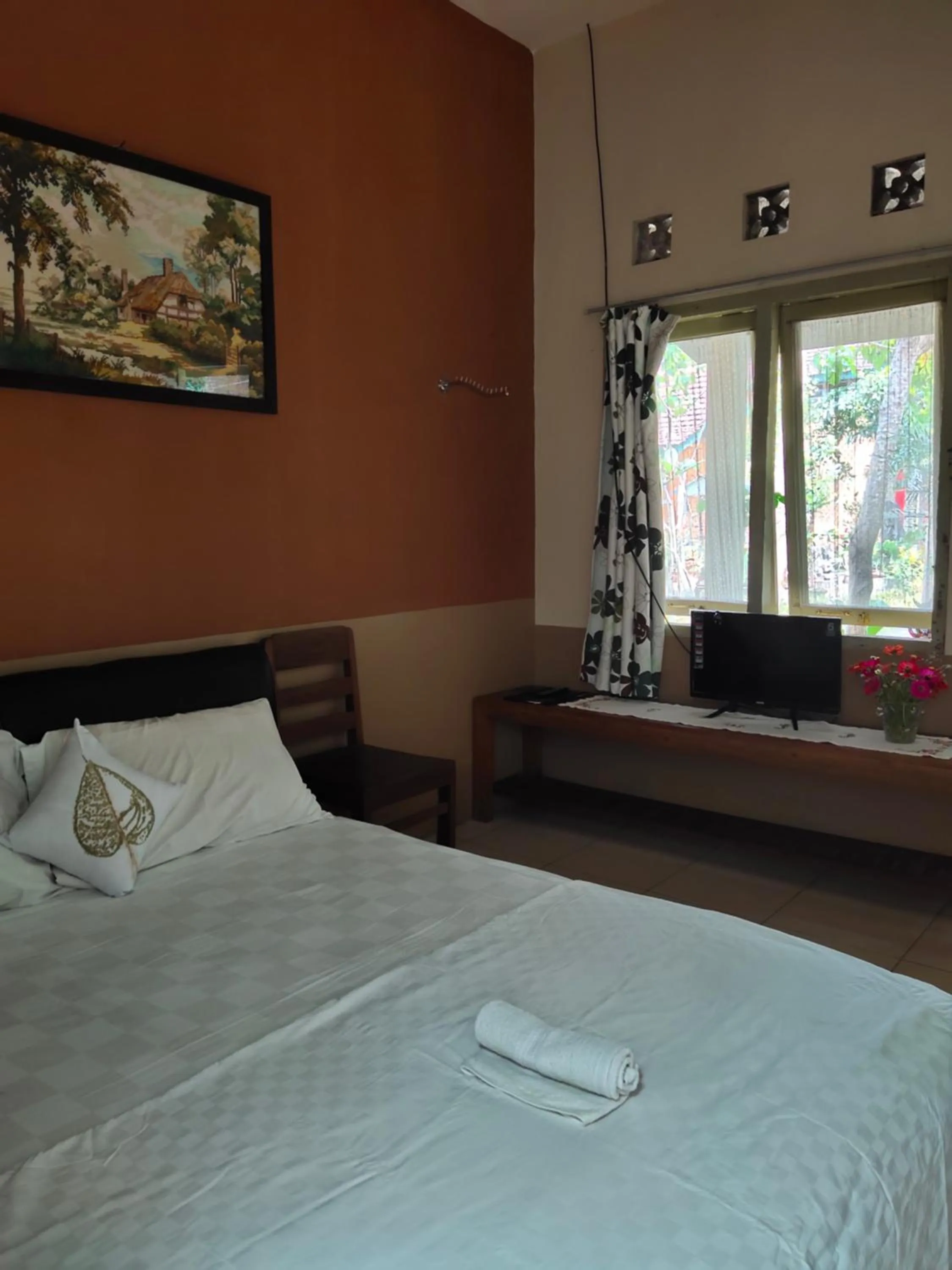 Bed in Mettaloka Guesthouse