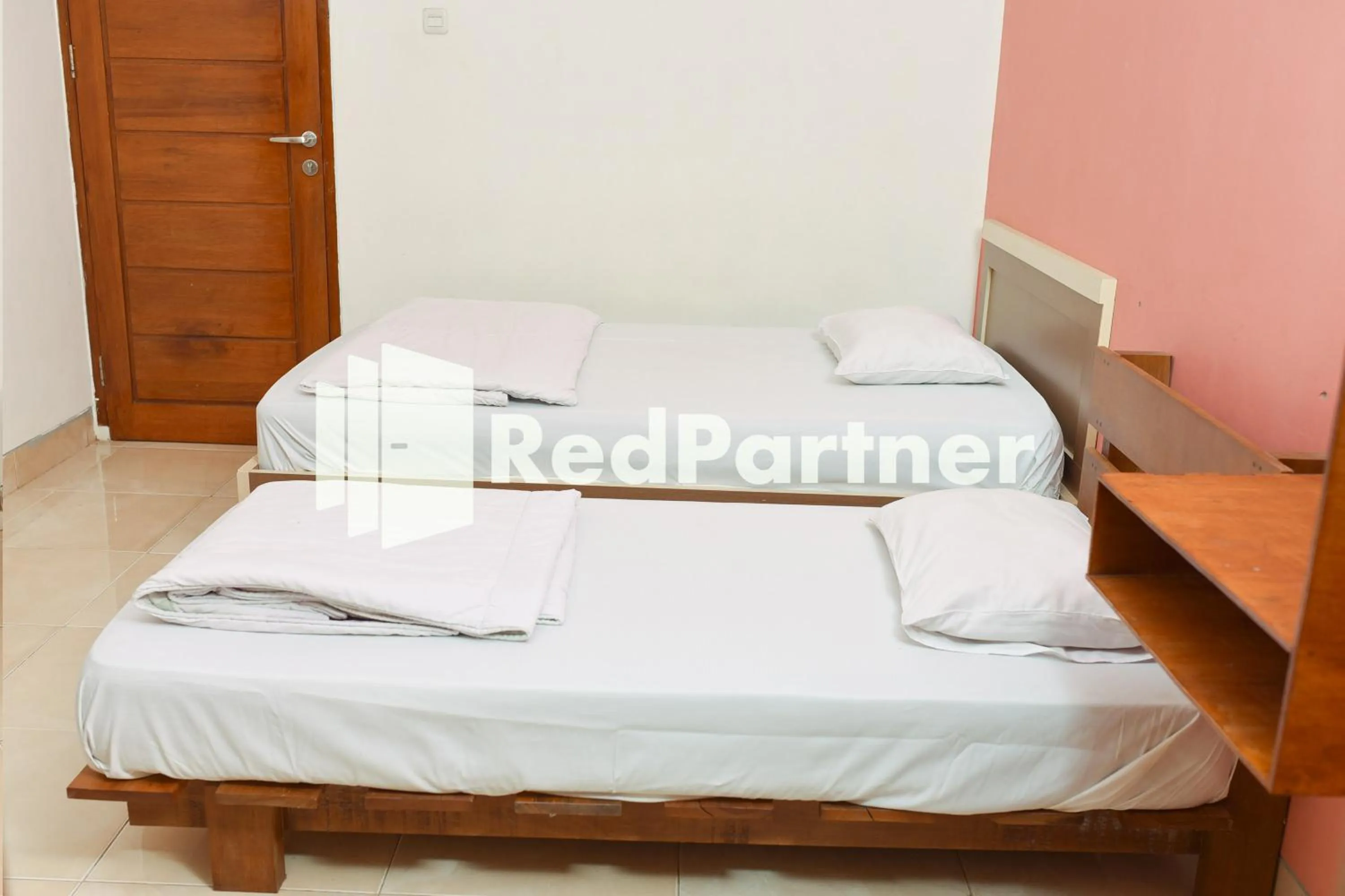 Bed in Homestay Rumah Citra Indah Syariah Mitra RedDoorz