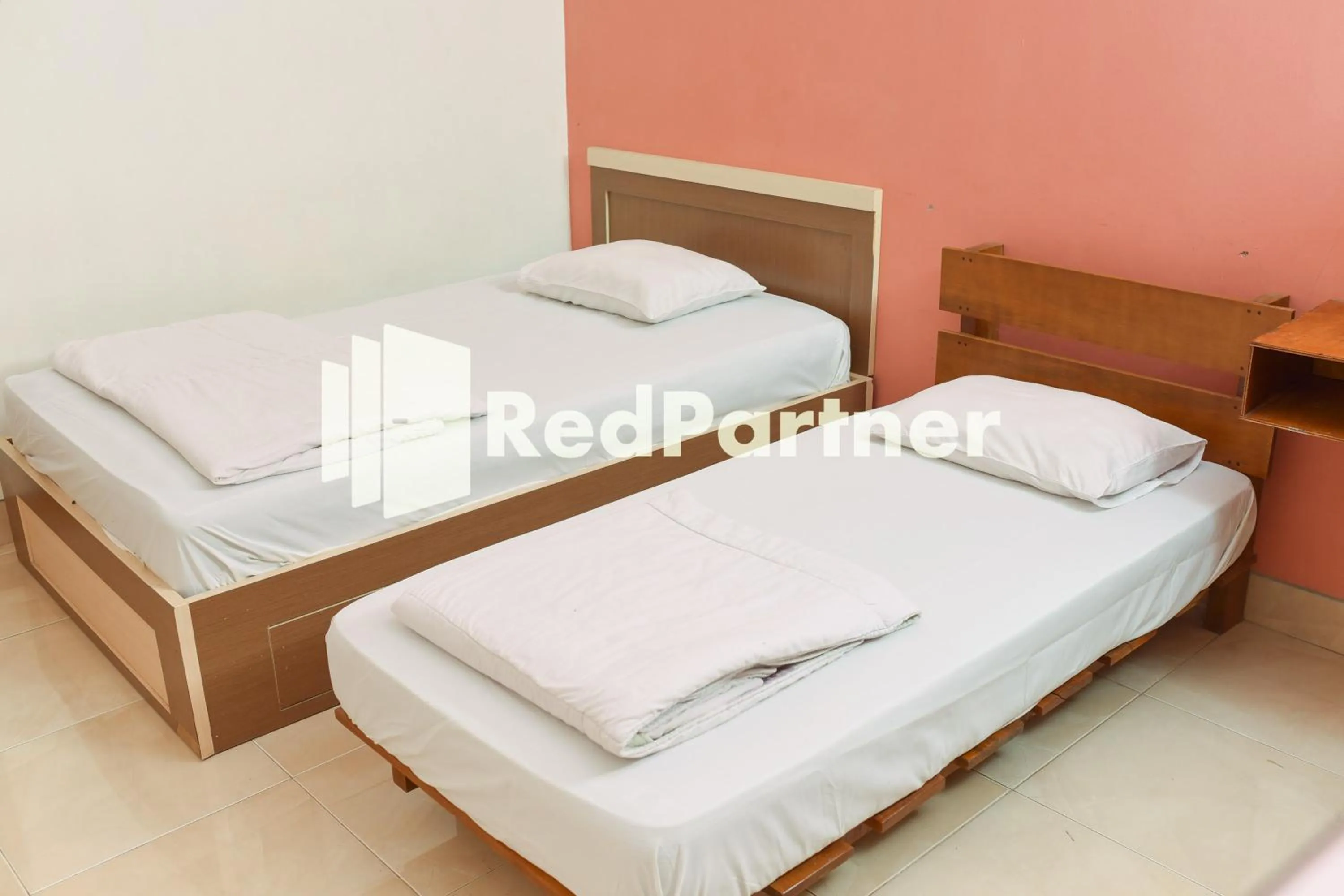 Bed in Homestay Rumah Citra Indah Syariah Mitra RedDoorz