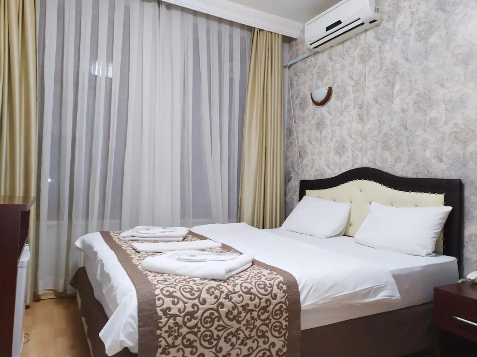 Bed in Taxim Hotel Marin