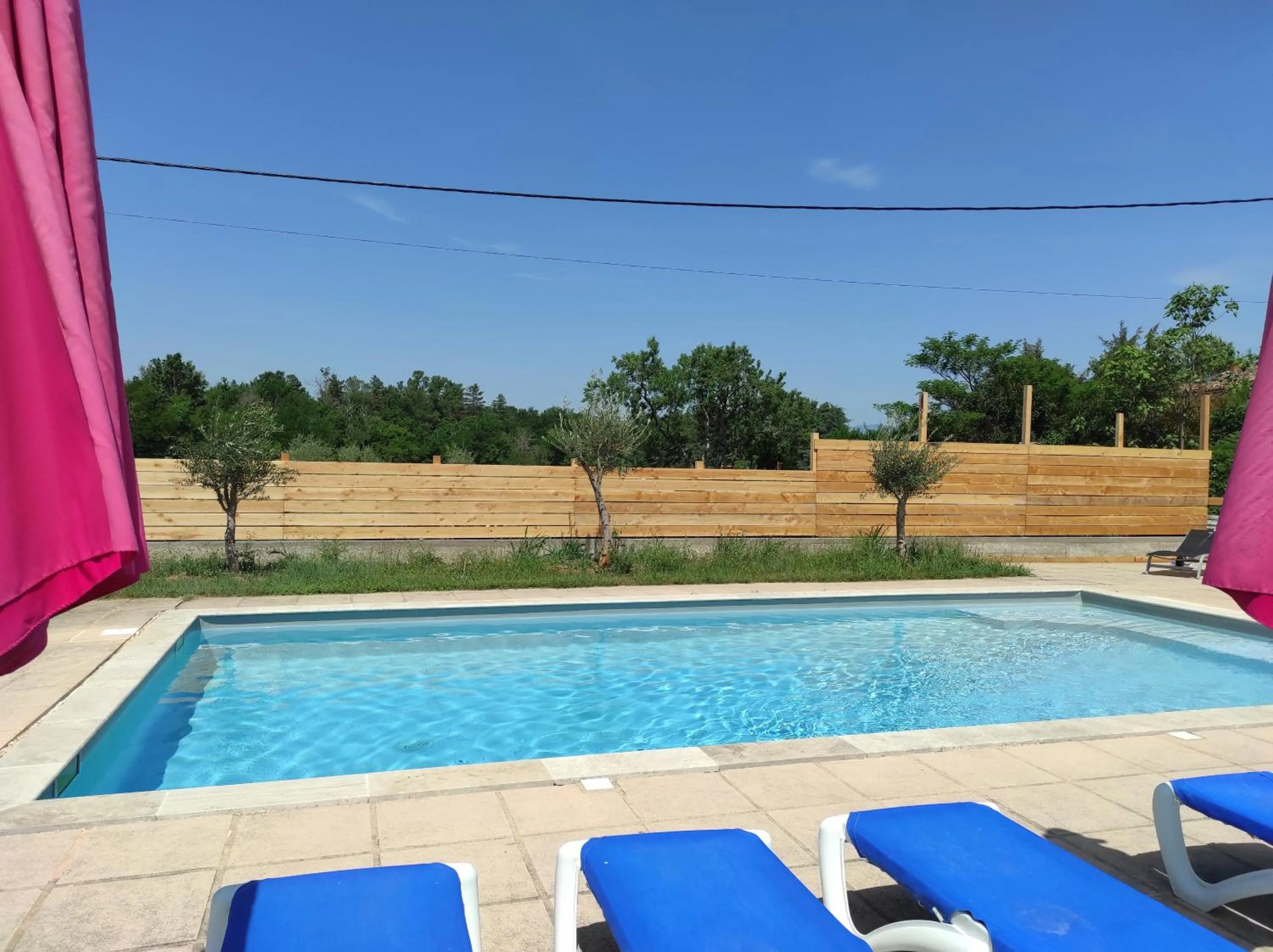 Swimming pool in Logis Hôtel Restaurant Gîte La Bastide du Vébron