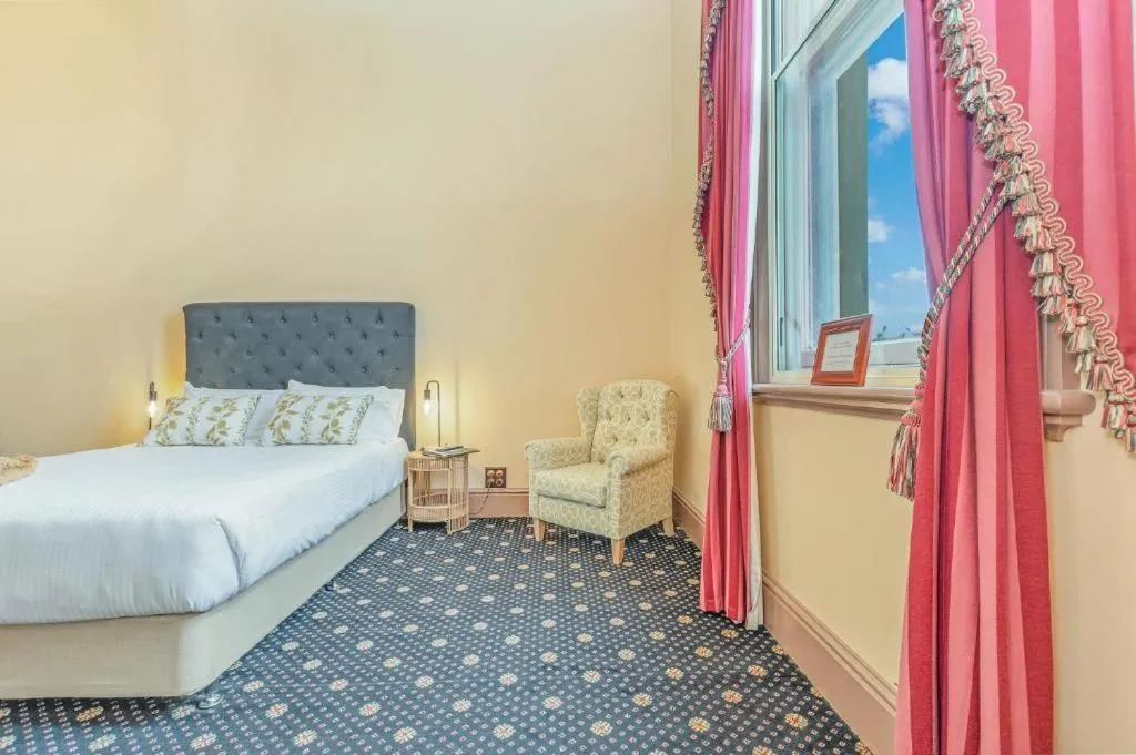 Bed in Clocktower Suites