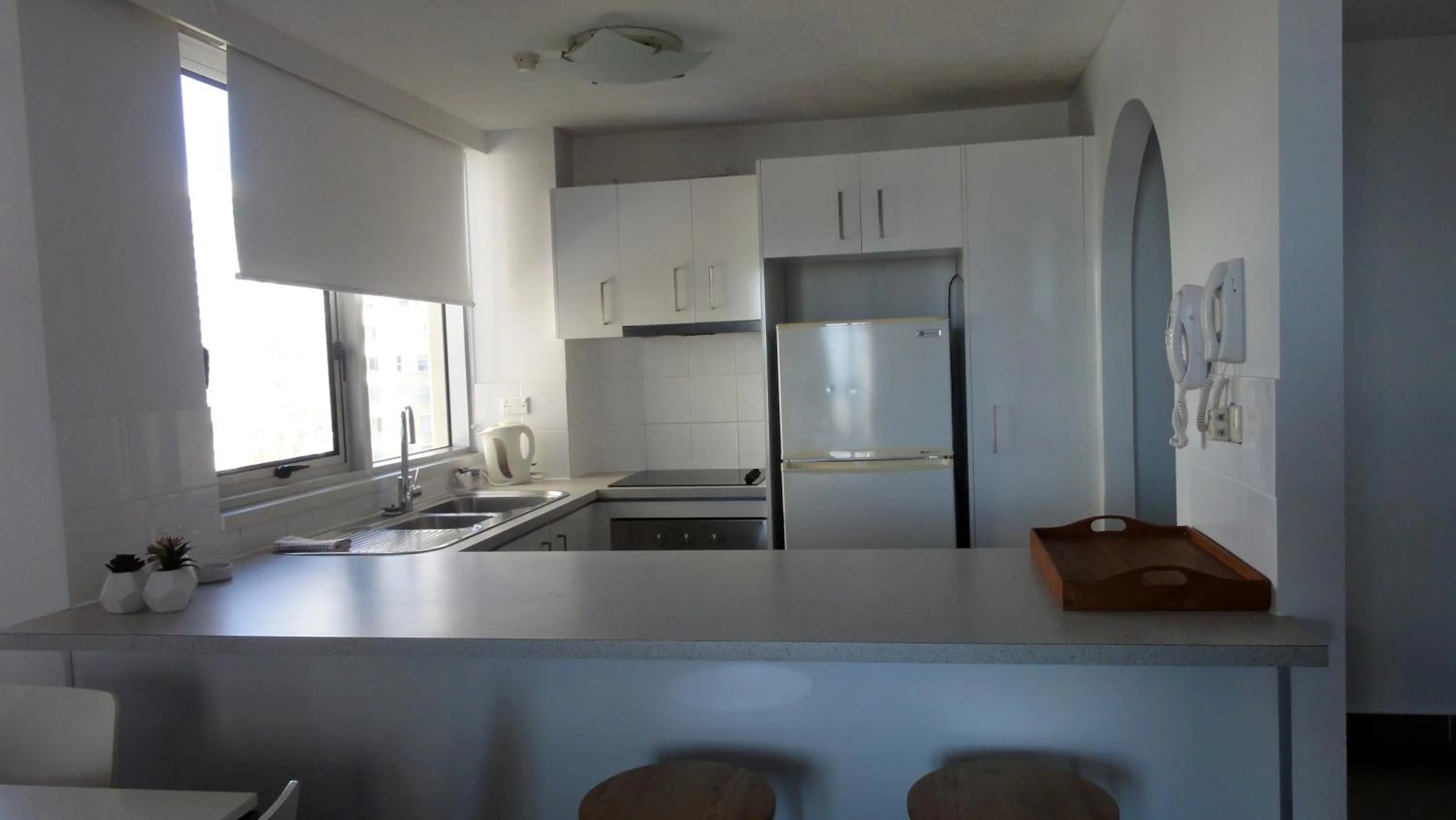 Kitchen or kitchenette in Quarterdeck Apartments