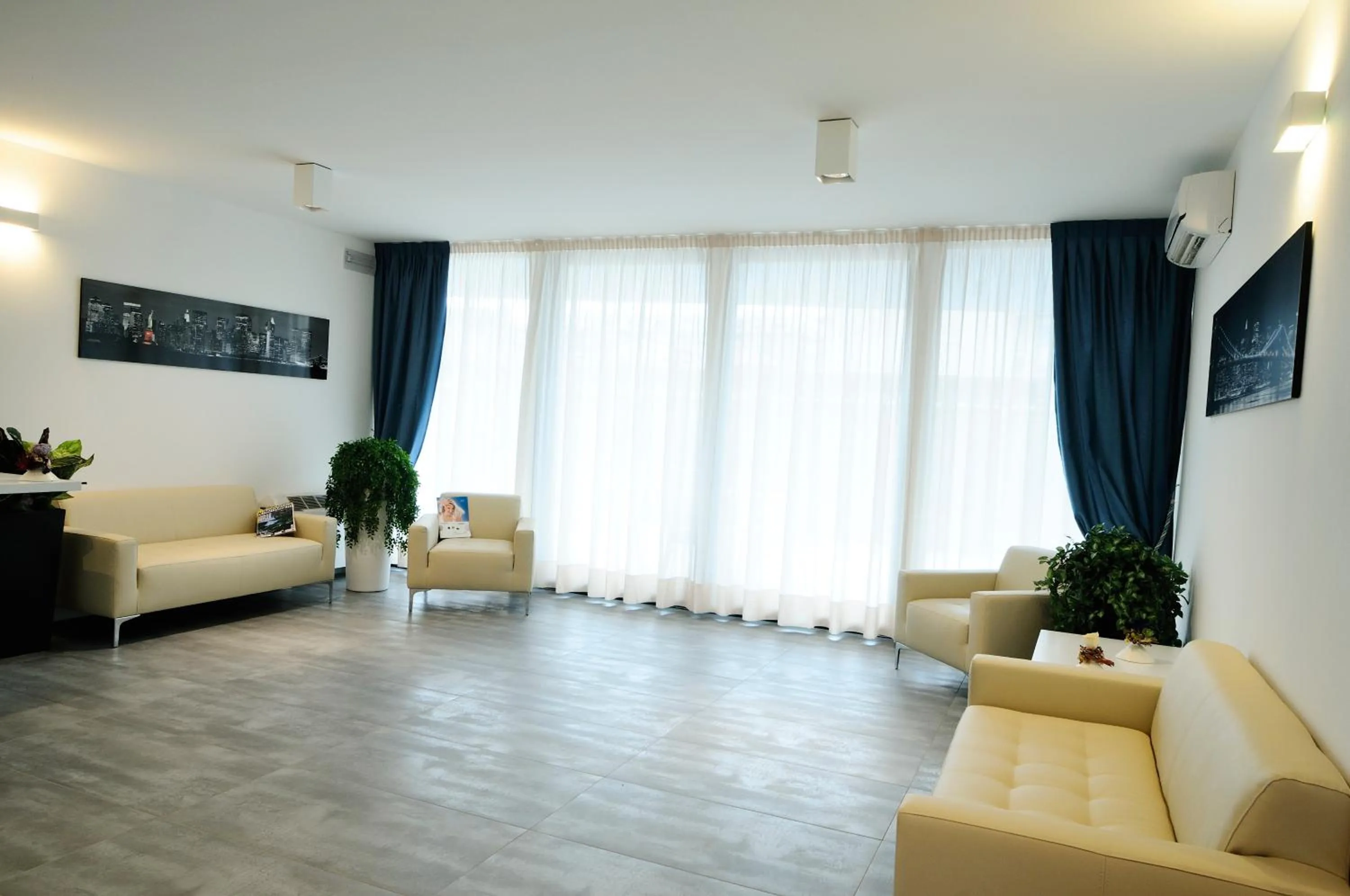 Communal lounge/ TV room in Aparthotel Tiziano