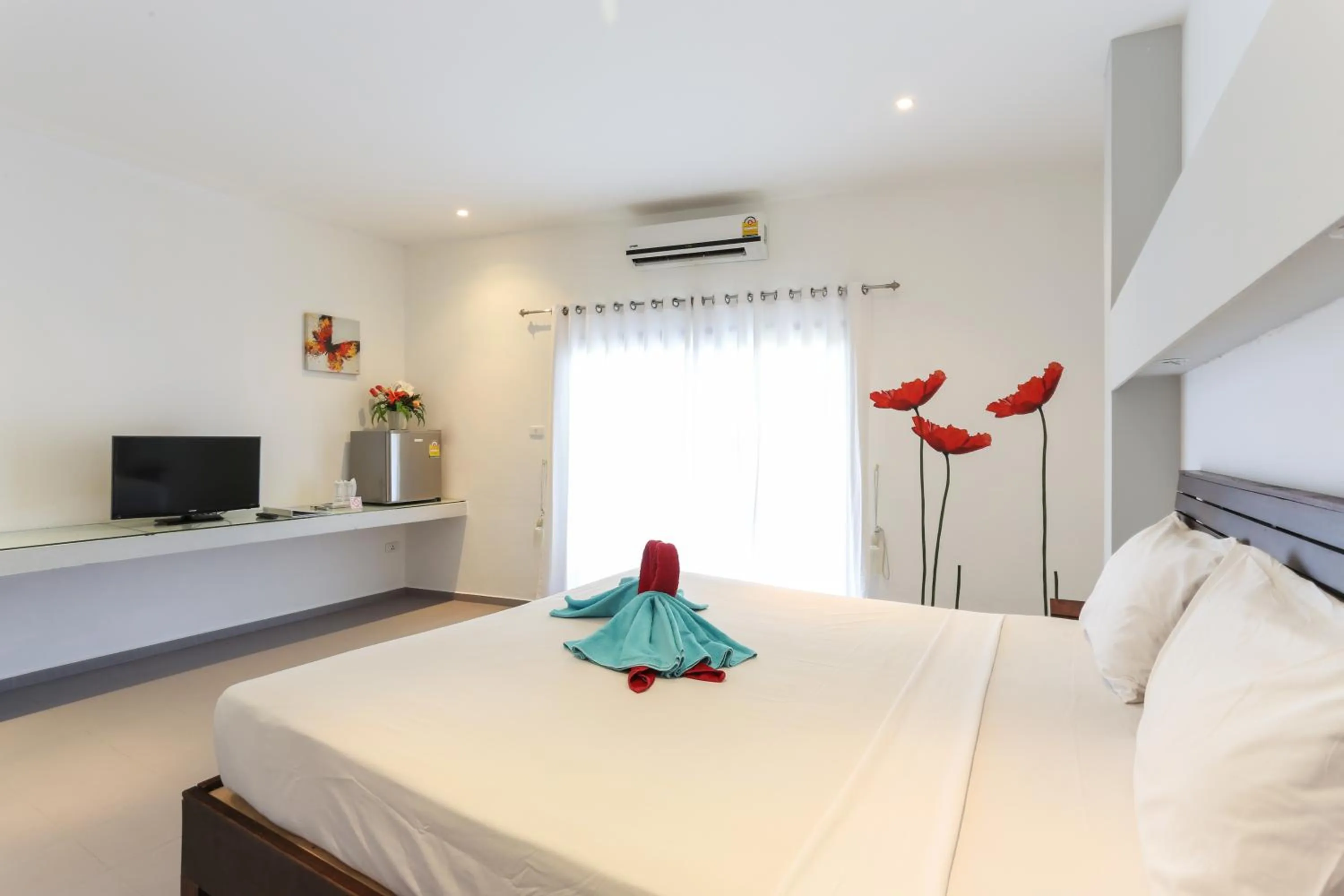 Photo of the whole room, Bed in Austrian Garden Hotel & Restaurant Patong