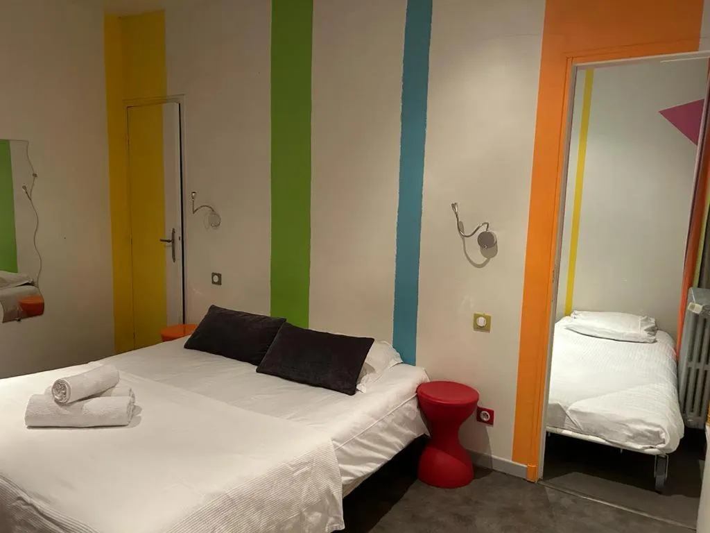 Bed in Logis Hotel Restaurant Le Grand Puech