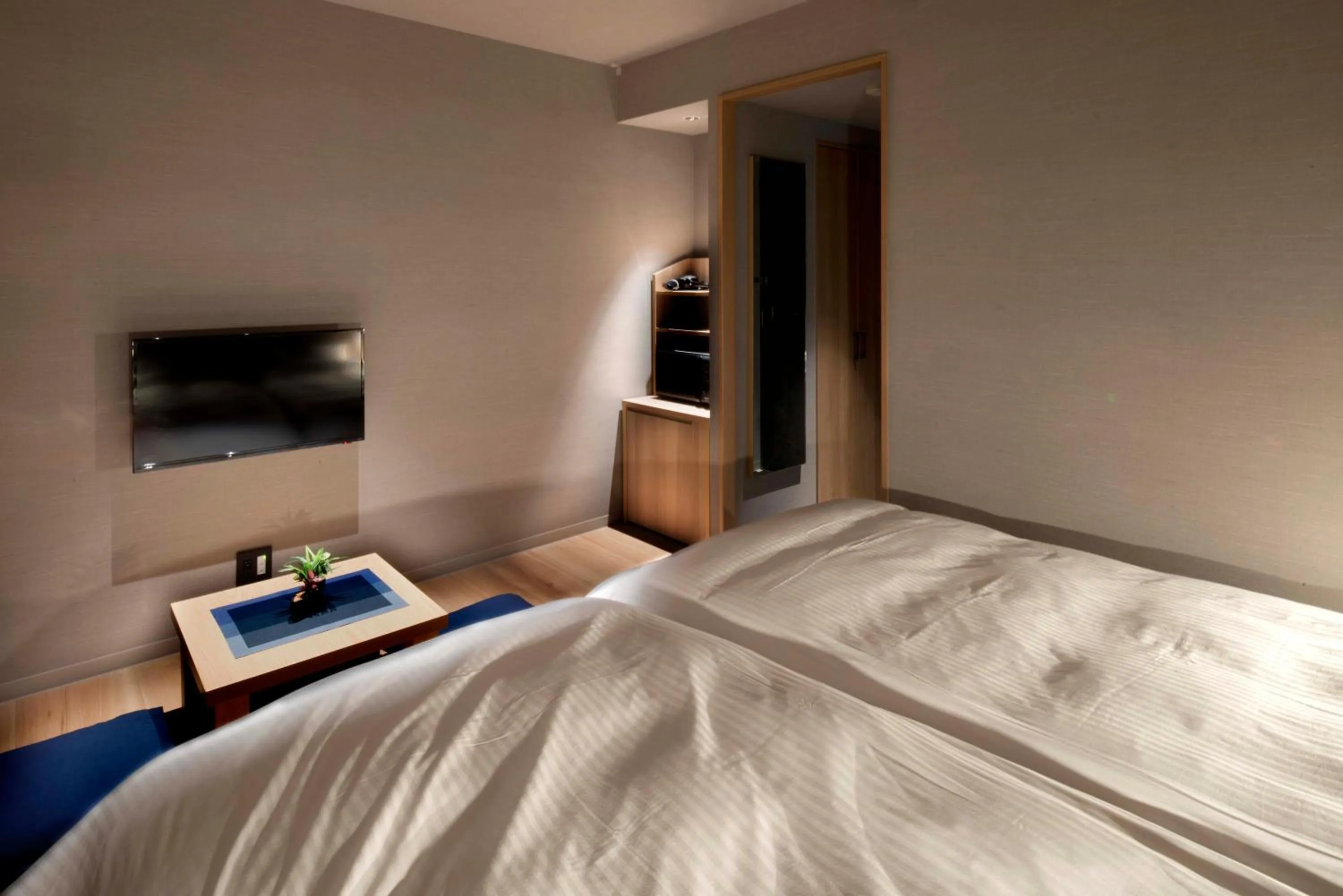 Bed in ALPHABED INN Takamatsuekimae