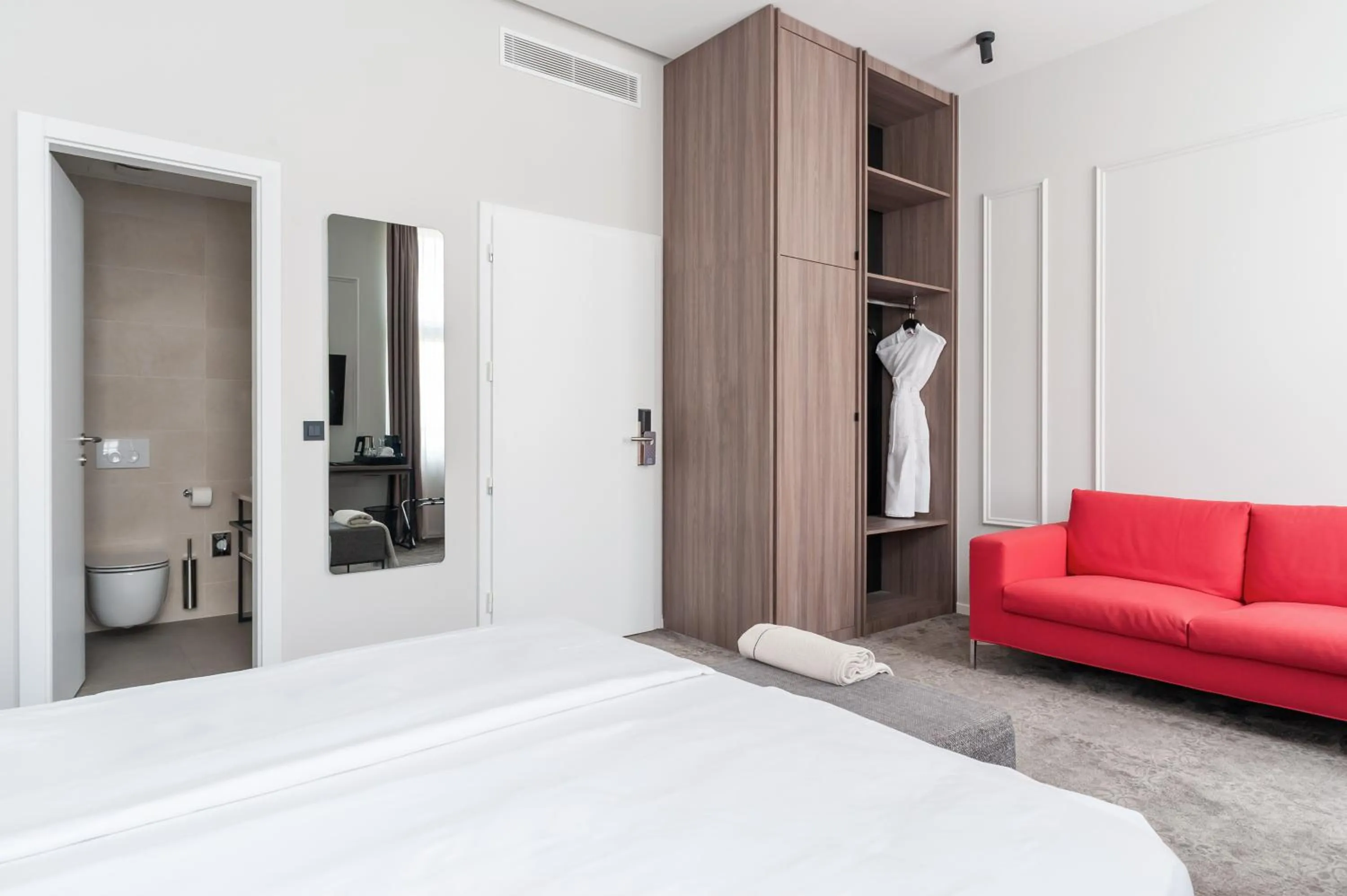 Seating area, Bed in MANDA Heritage Hotel