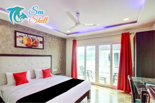 Bed in Sea Shell Beach Cottages & Suites