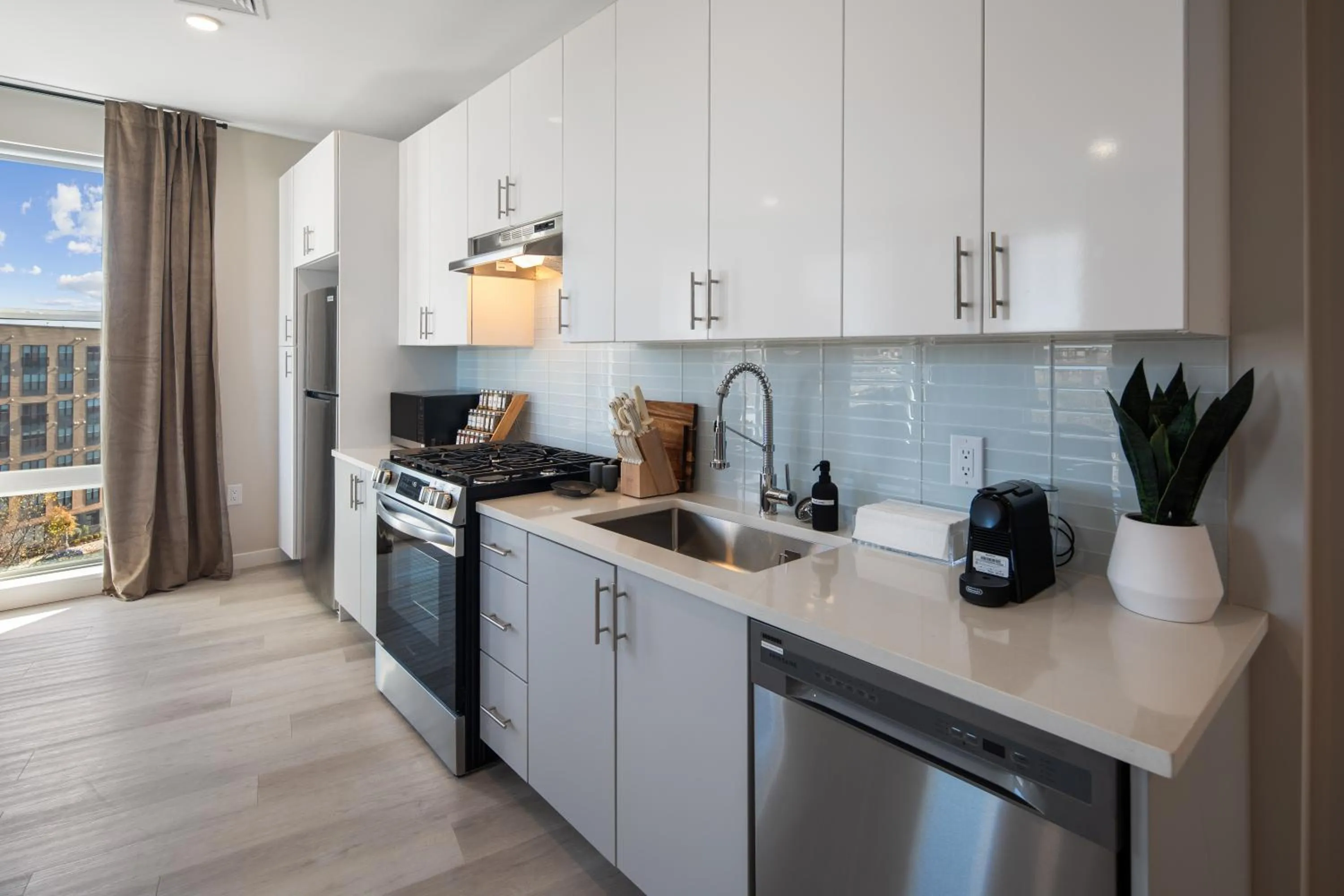 Kitchen or kitchenette in Luxury Furnished Apartments by Hyatus Downtown at Yale