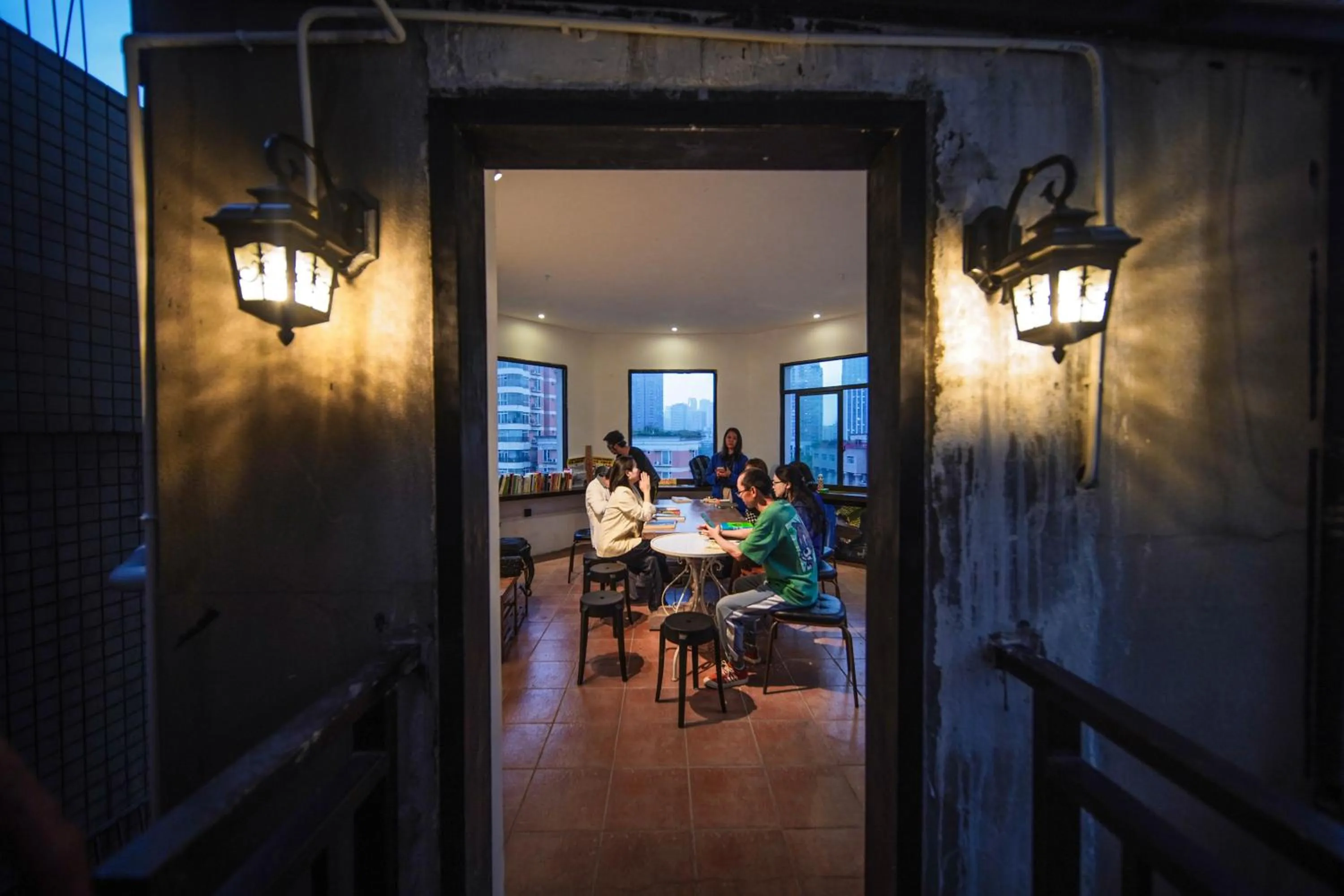 Seating area in Chengdu Local Tea Hostel - Short Walk To Taikooli - Chill & Social Coffee Lounge - Metro downstairs - Free Activities - Friendly English Speaking Staff - Tibet, Panda, Buddha & Snow Mountain Tours