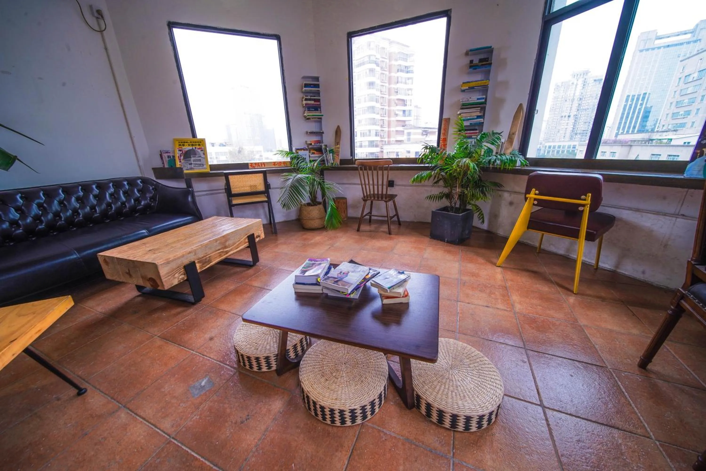 Seating area in Chengdu Local Tea Hostel - Short Walk To Taikooli - Chill & Social Coffee Lounge - Metro downstairs - Free Activities - Friendly English Speaking Staff - Tibet, Panda, Buddha & Snow Mountain Tours