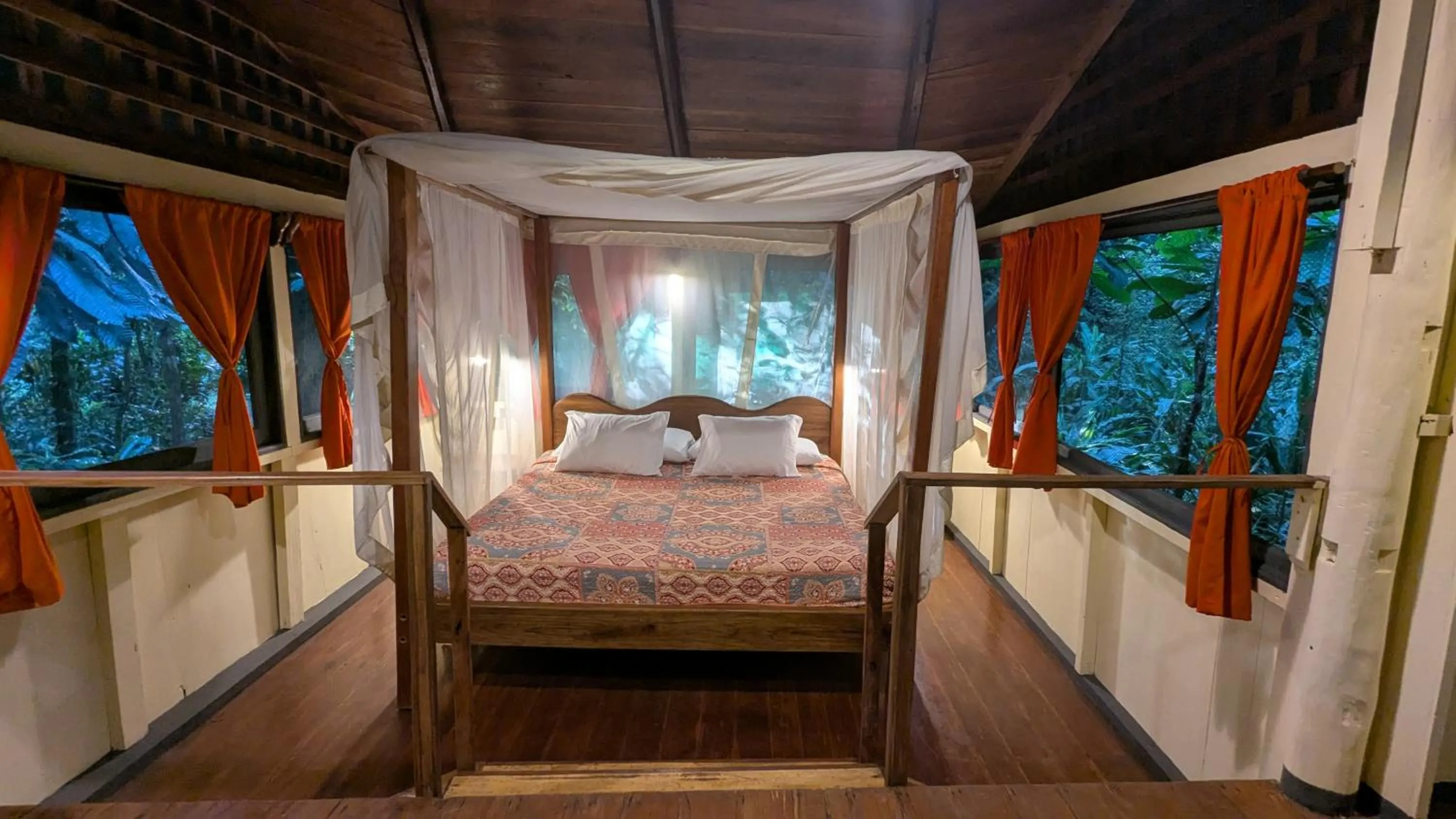 Bed in Tree House Beachfront Lodge