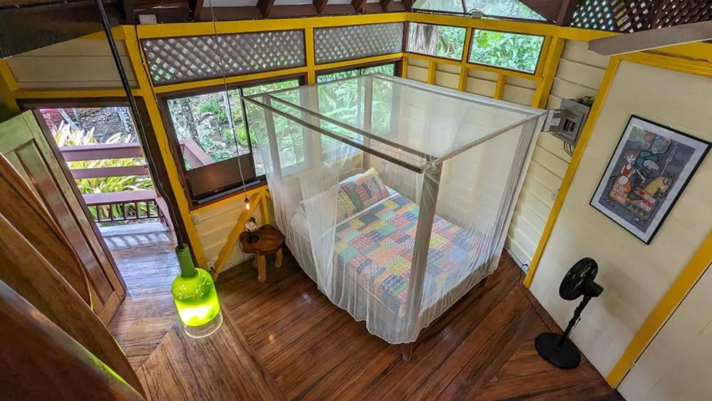 Bed in Tree House Beachfront Lodge