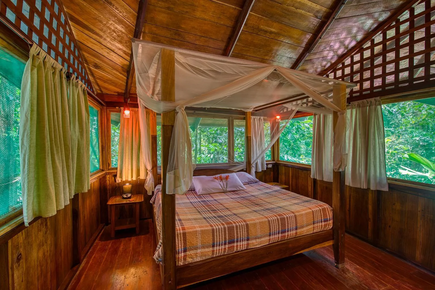 Bed in Tree House Beachfront Lodge