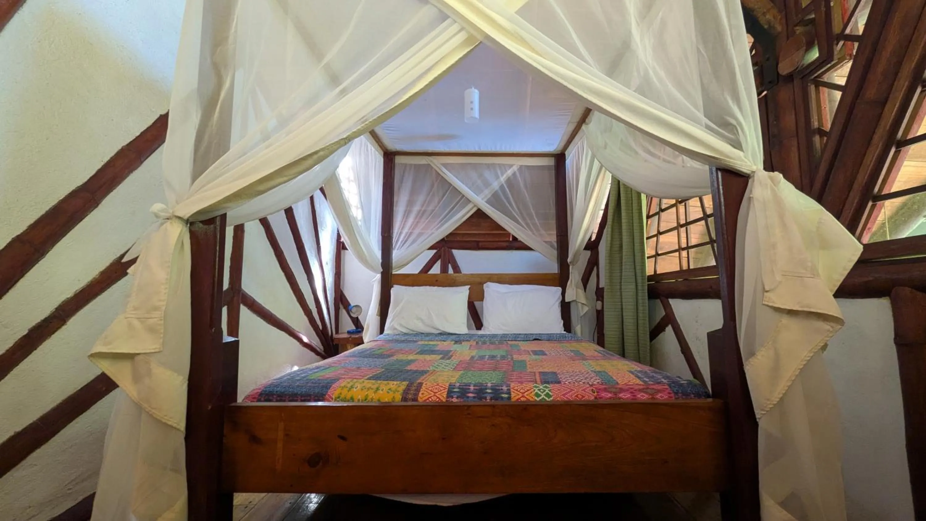 Bedroom, Bed in Tree House Beachfront Lodge