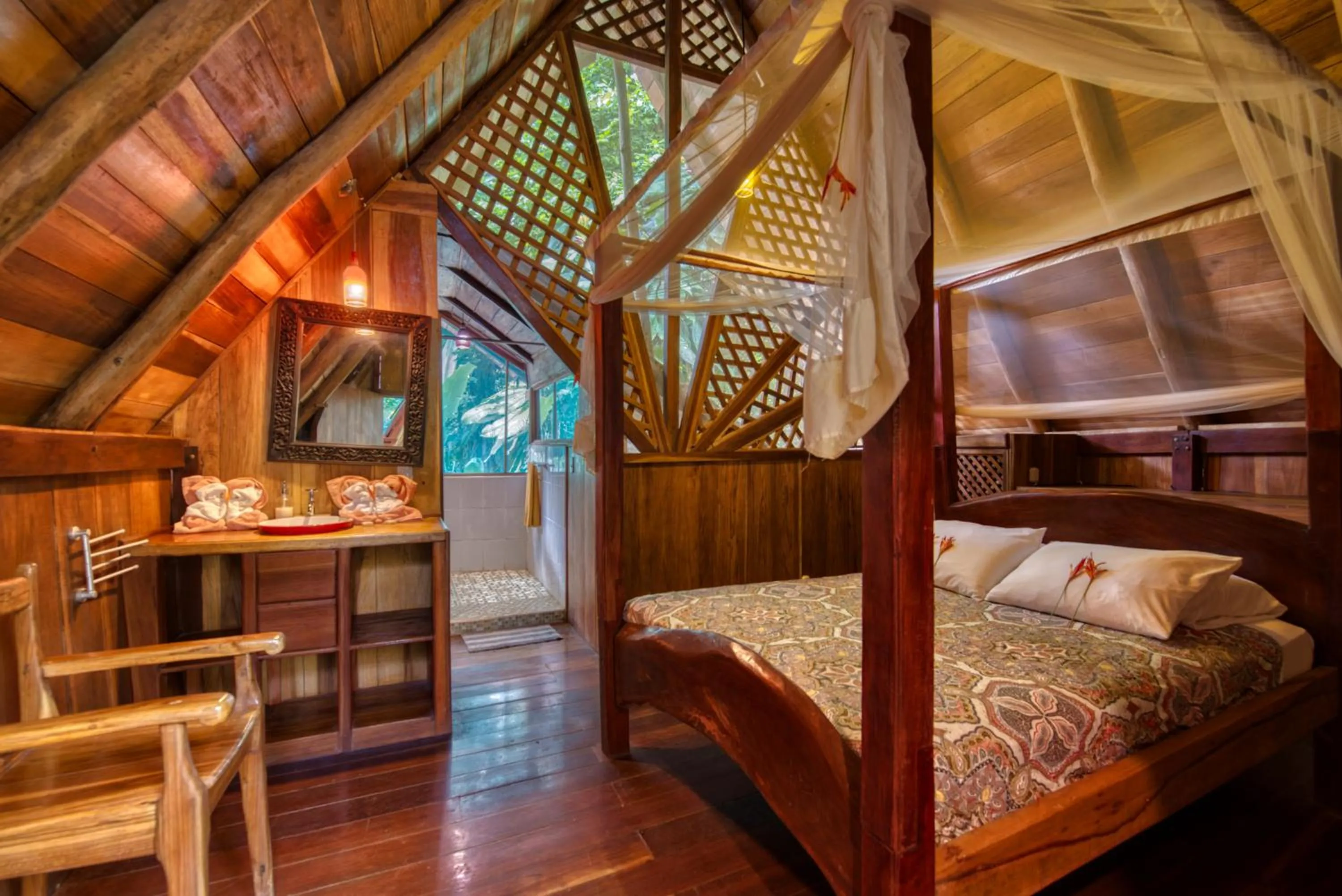 Bed in Tree House Beachfront Lodge