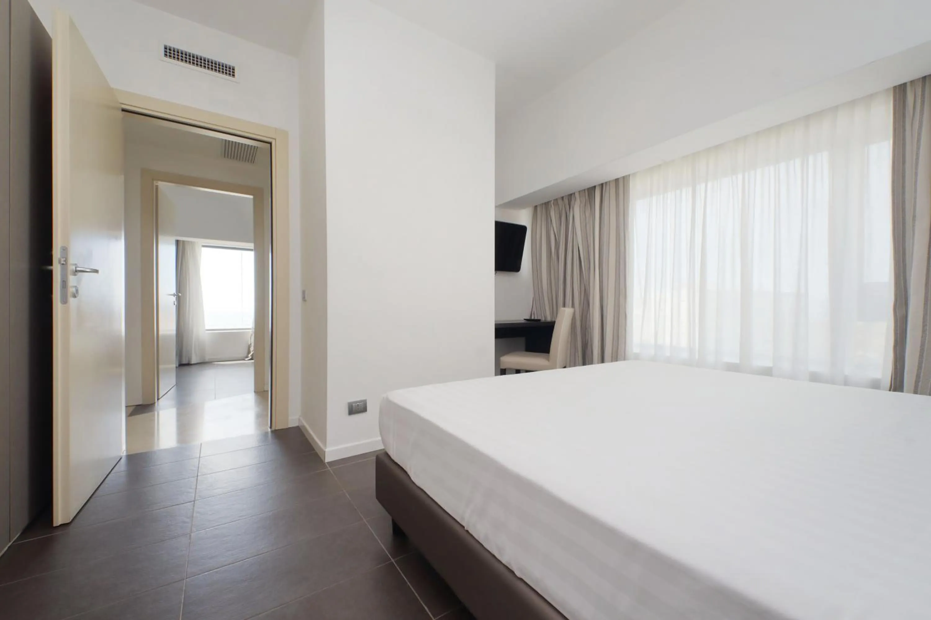 Bed in Hotel Poseidon