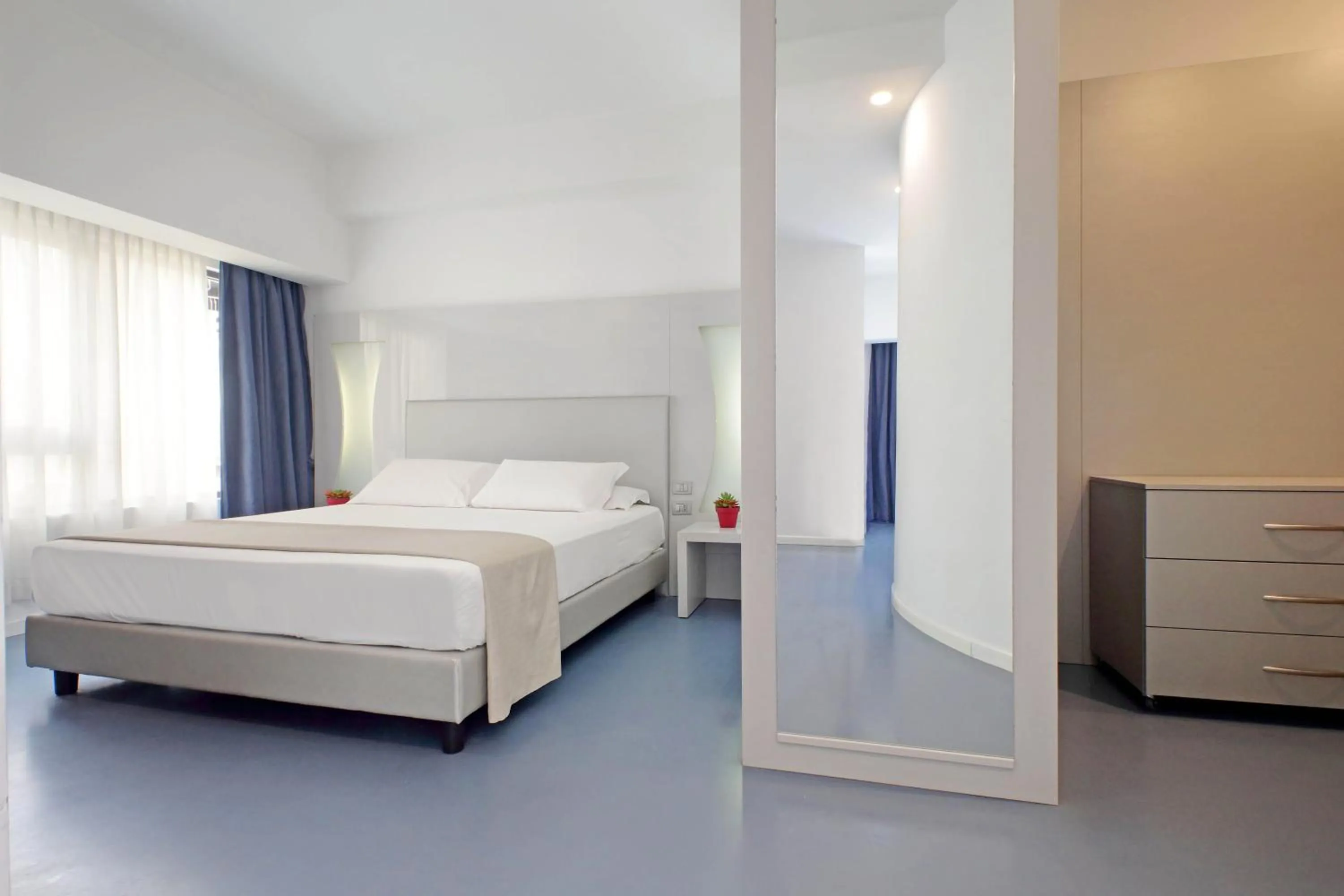 Bed in Hotel Poseidon