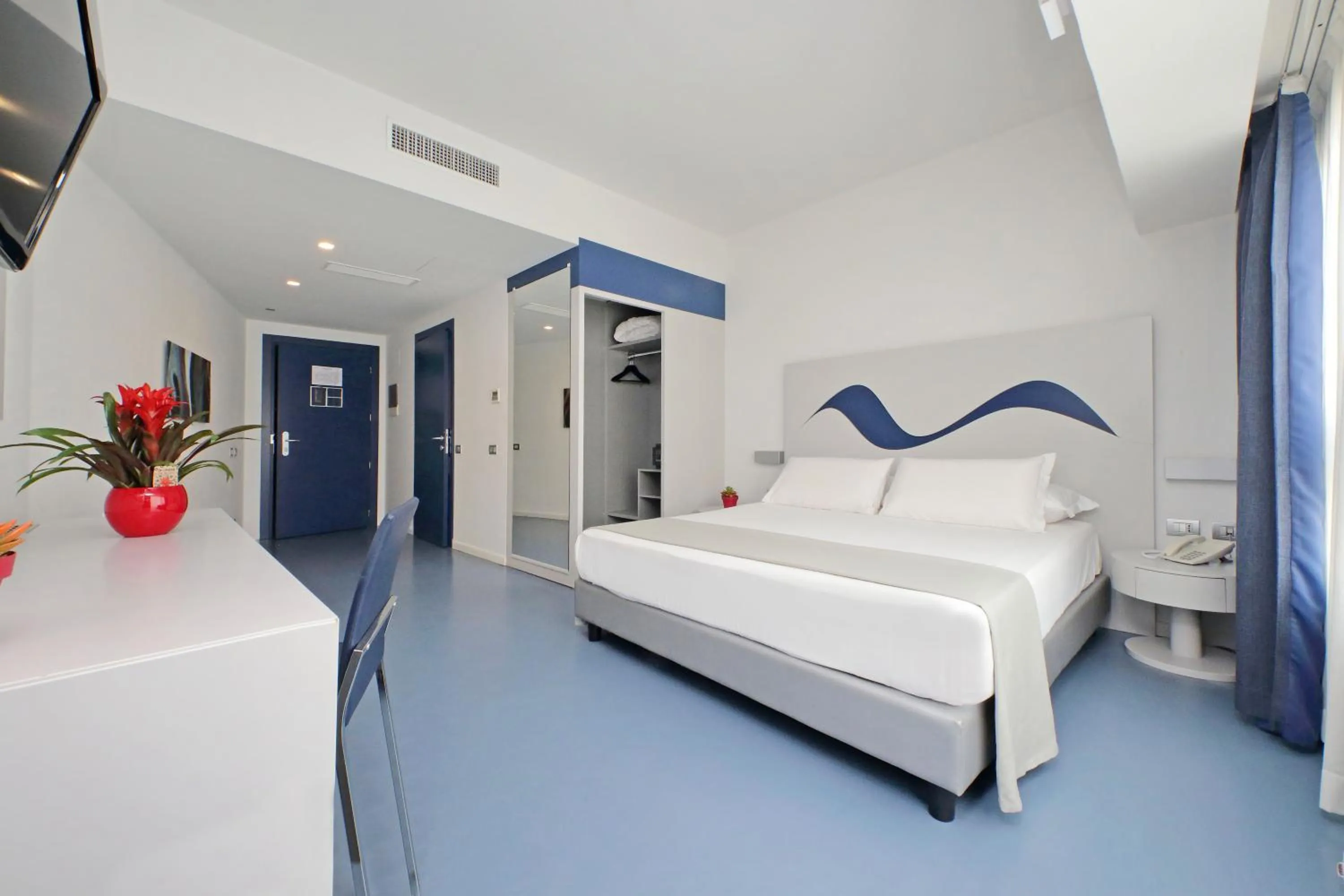 Bed in Hotel Poseidon