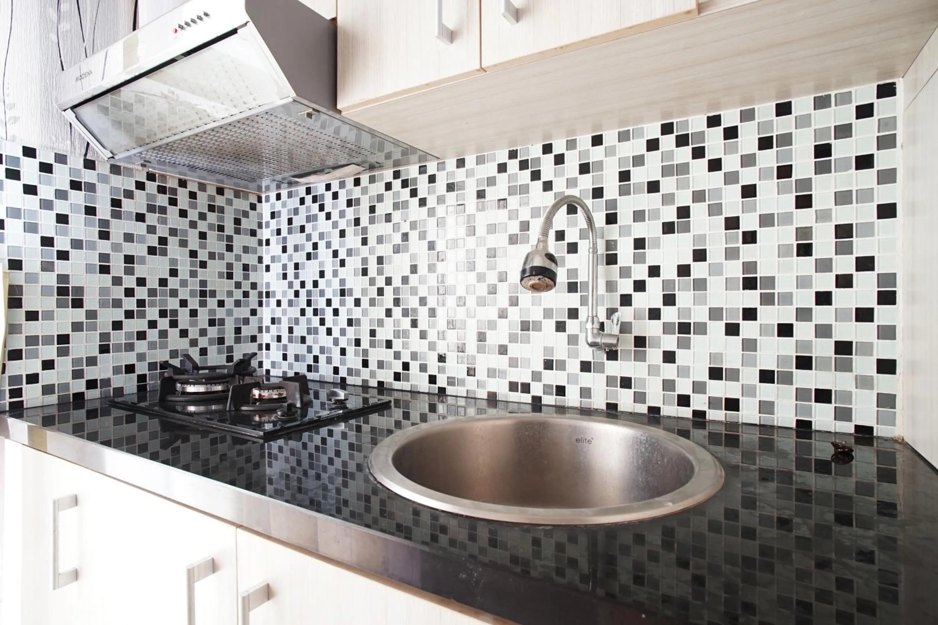 Kitchen or kitchenette in Planet Room Kemang View