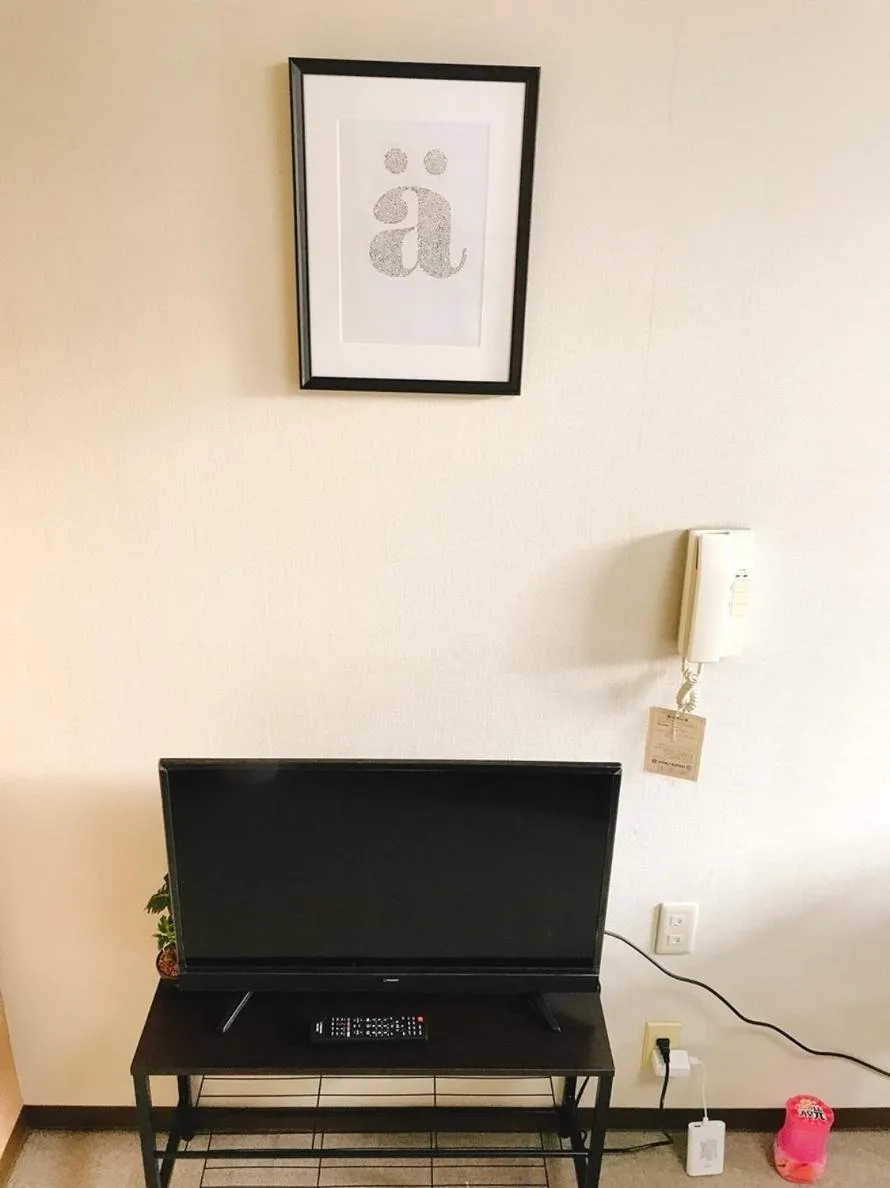 TV and multimedia in Joinus Ise Apartment by Tranova