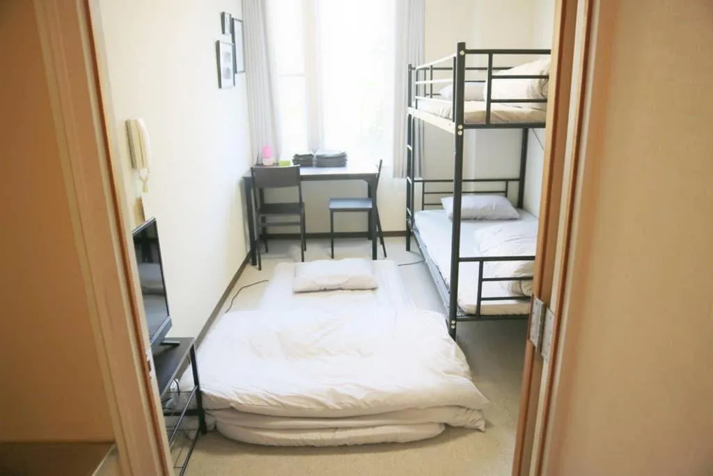 TV and multimedia, Bed in Joinus Ise Apartment by Tranova