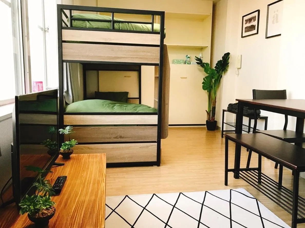 TV and multimedia, Bed in Joinus Ise Apartment by Tranova