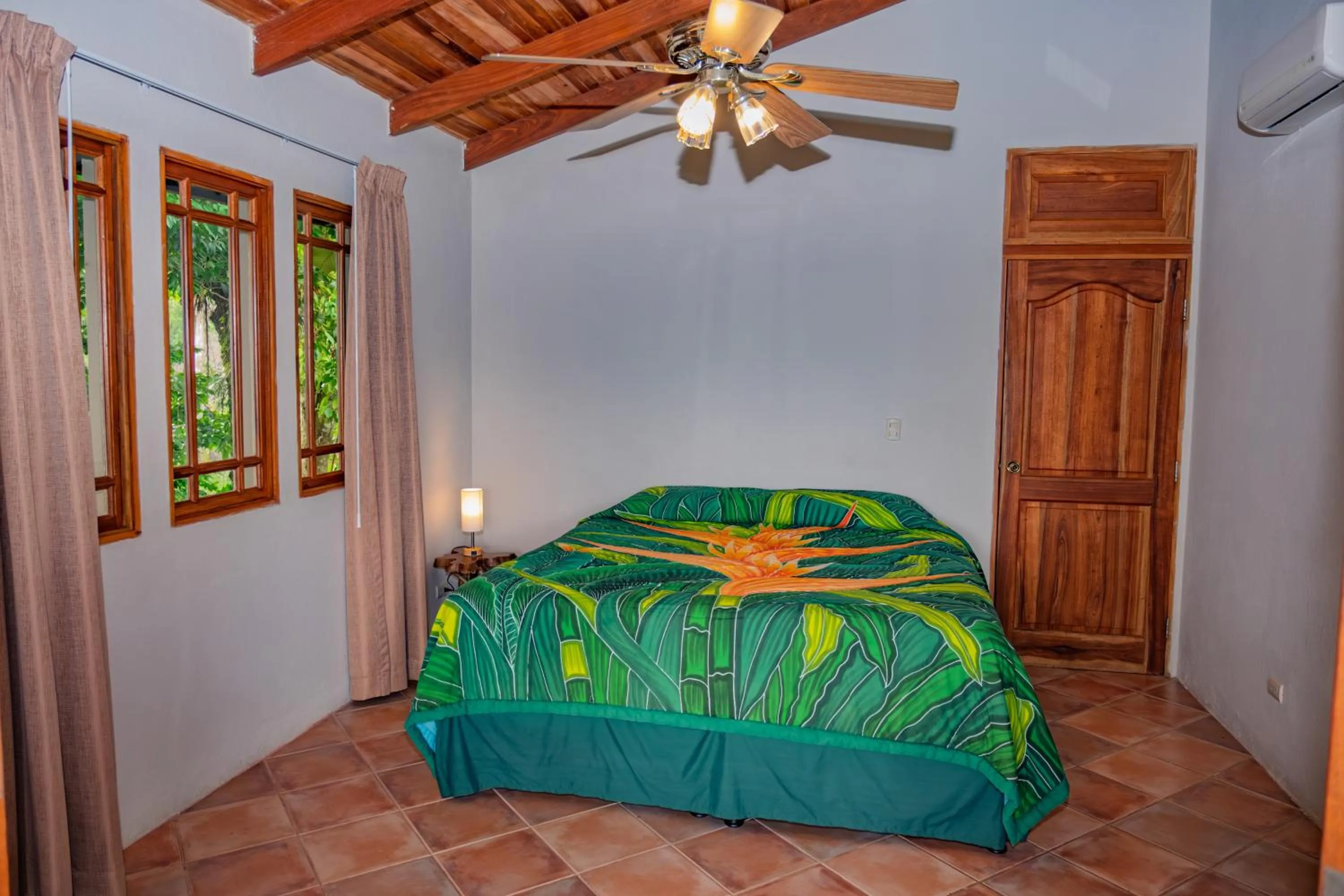 Bed in Lost Iguana Resort and Spa
