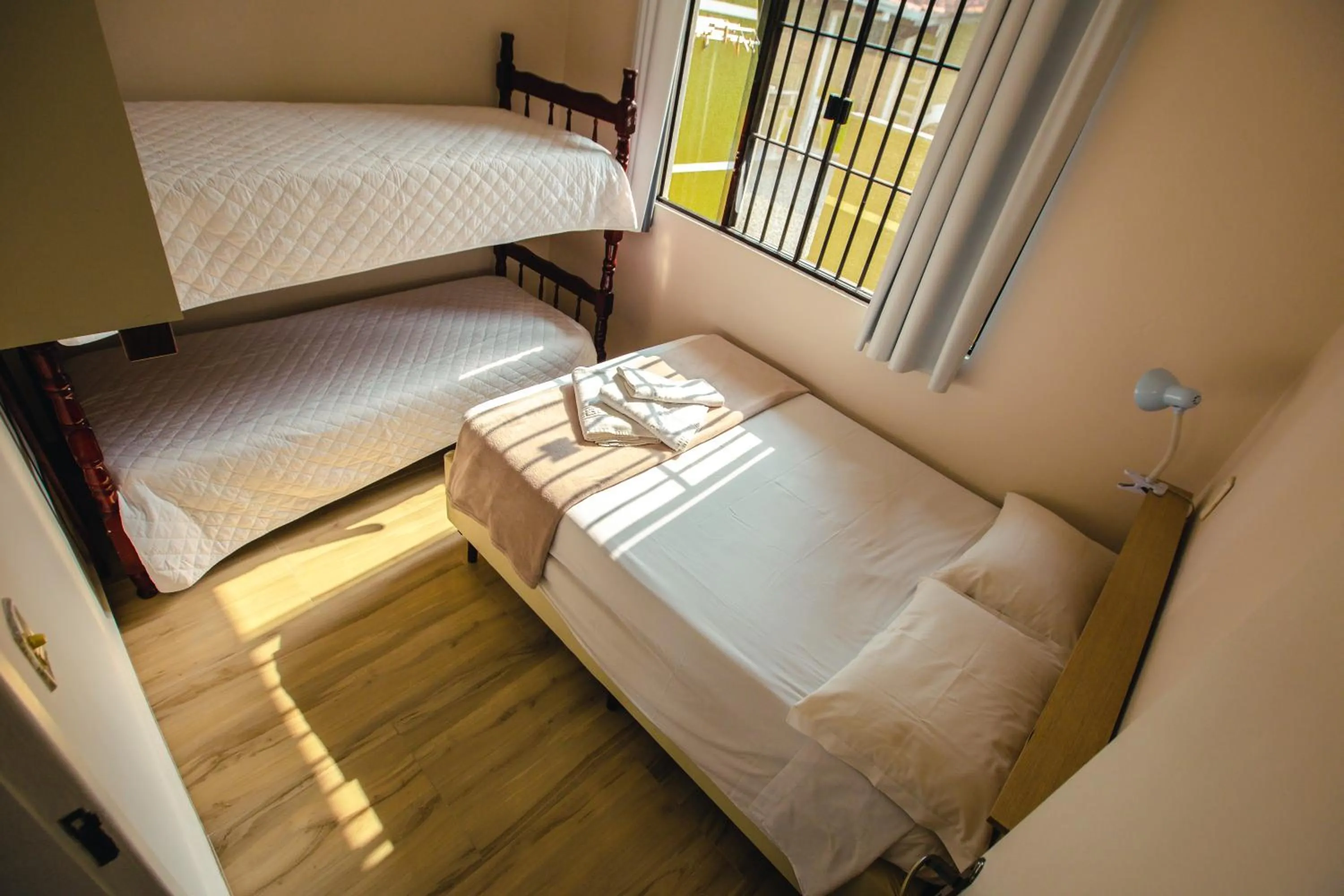 Bed in ApartPousada Residencial dos Reis