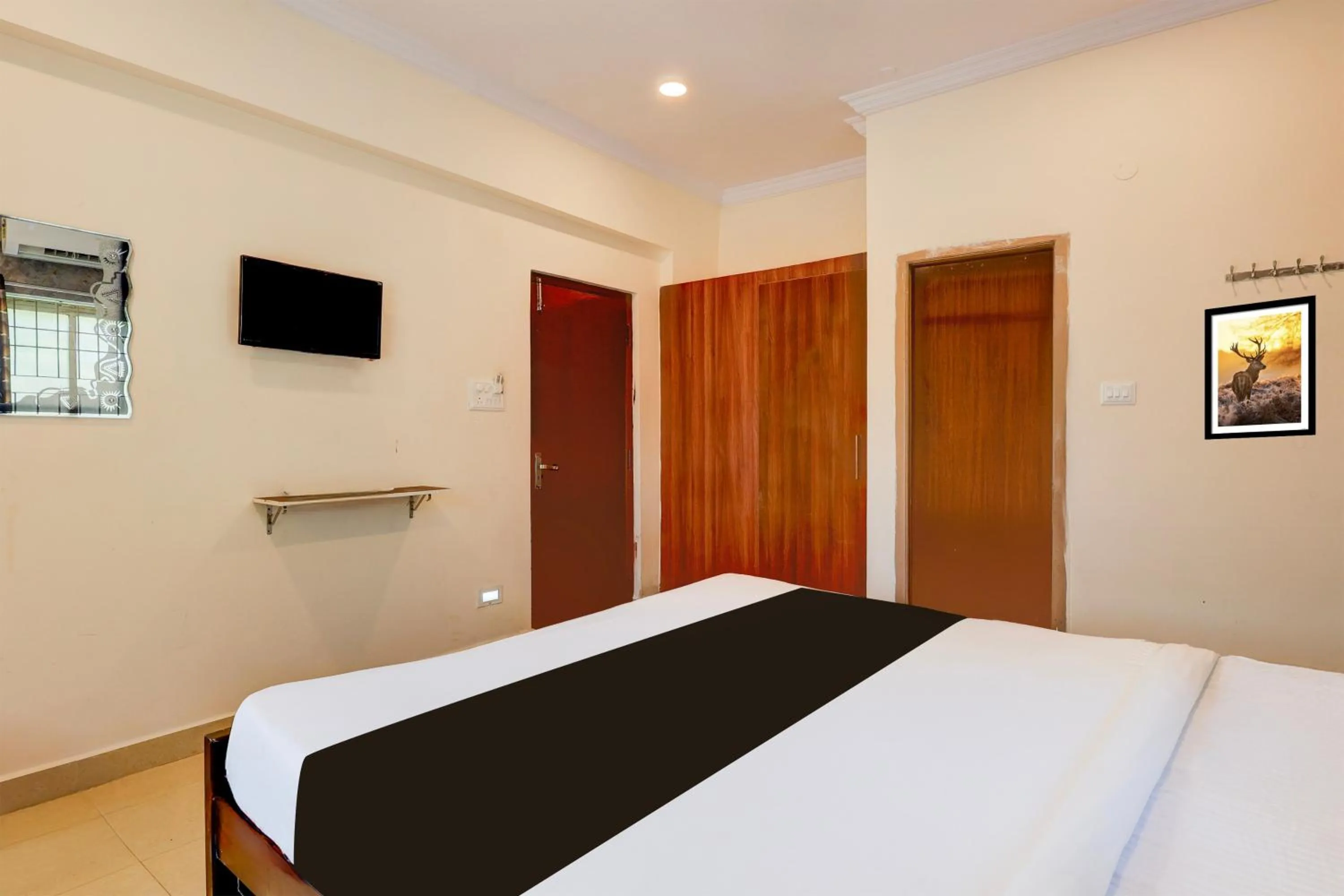 Bedroom, Bed in Super Hotel O Rushikonda Beach