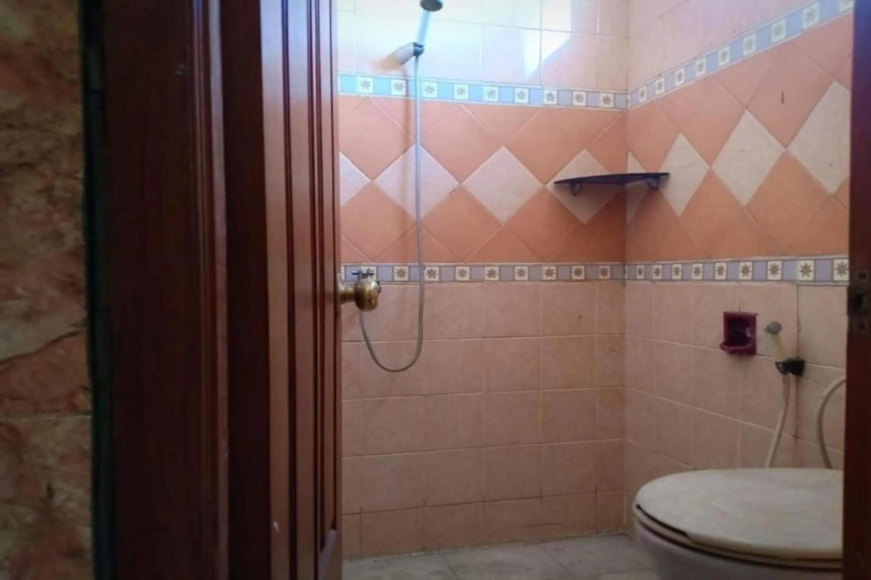 Bathroom in Hotel O Asti Residence 1