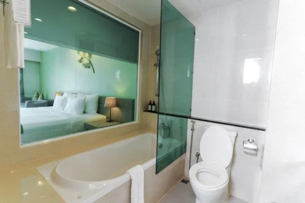 Bathroom, Bed in Tamarind Garden Hotel