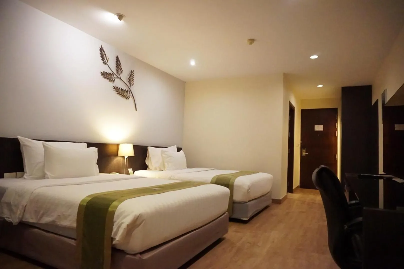 Bed in Tamarind Garden Hotel