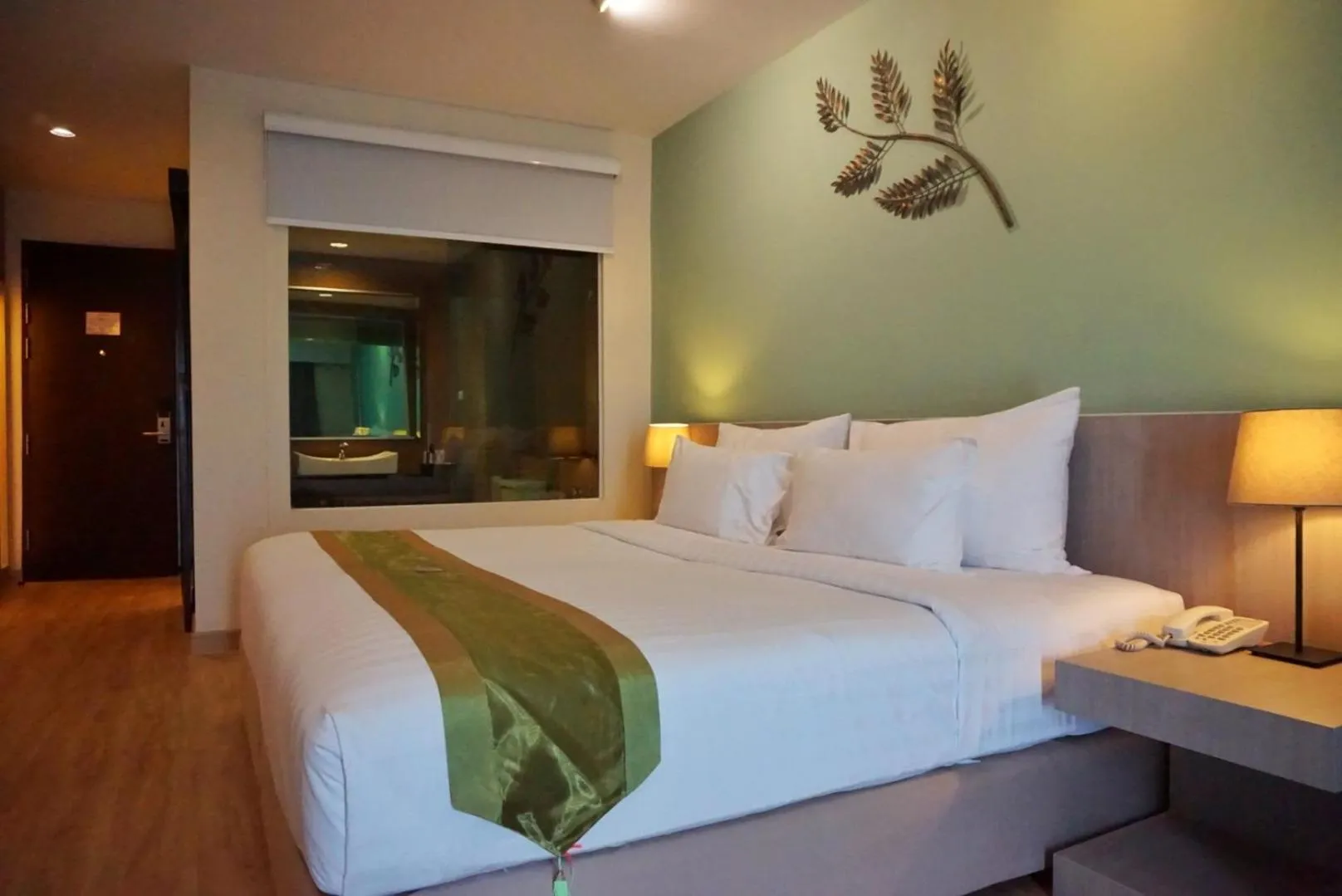 Bed in Tamarind Garden Hotel