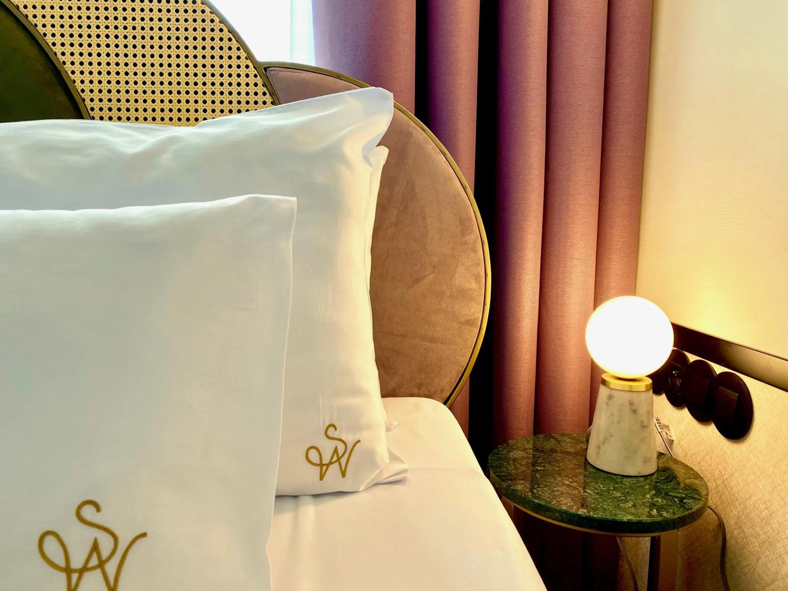 Bed in SleepWell Boutique Apartments